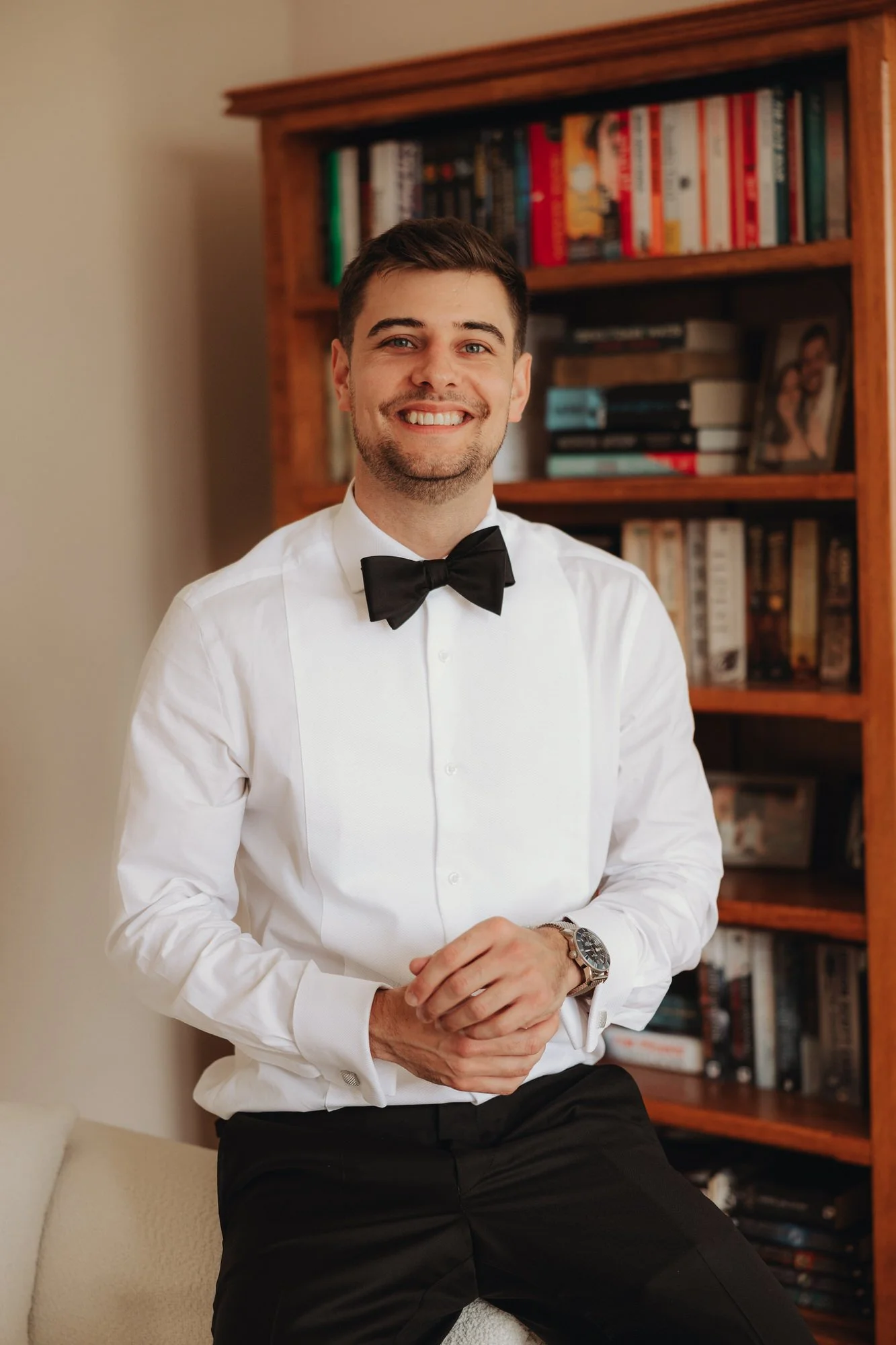Jonathan in a bow tie during wedding preparations