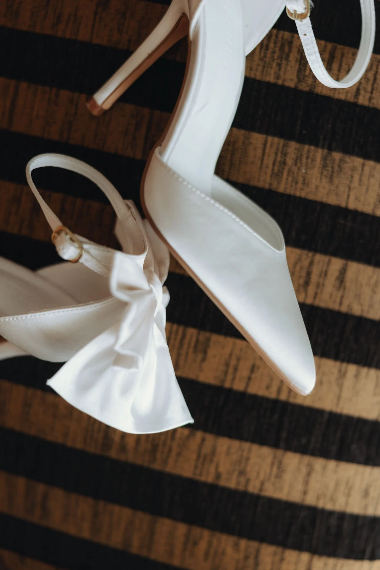 White bridal shoes on the wooden stairs