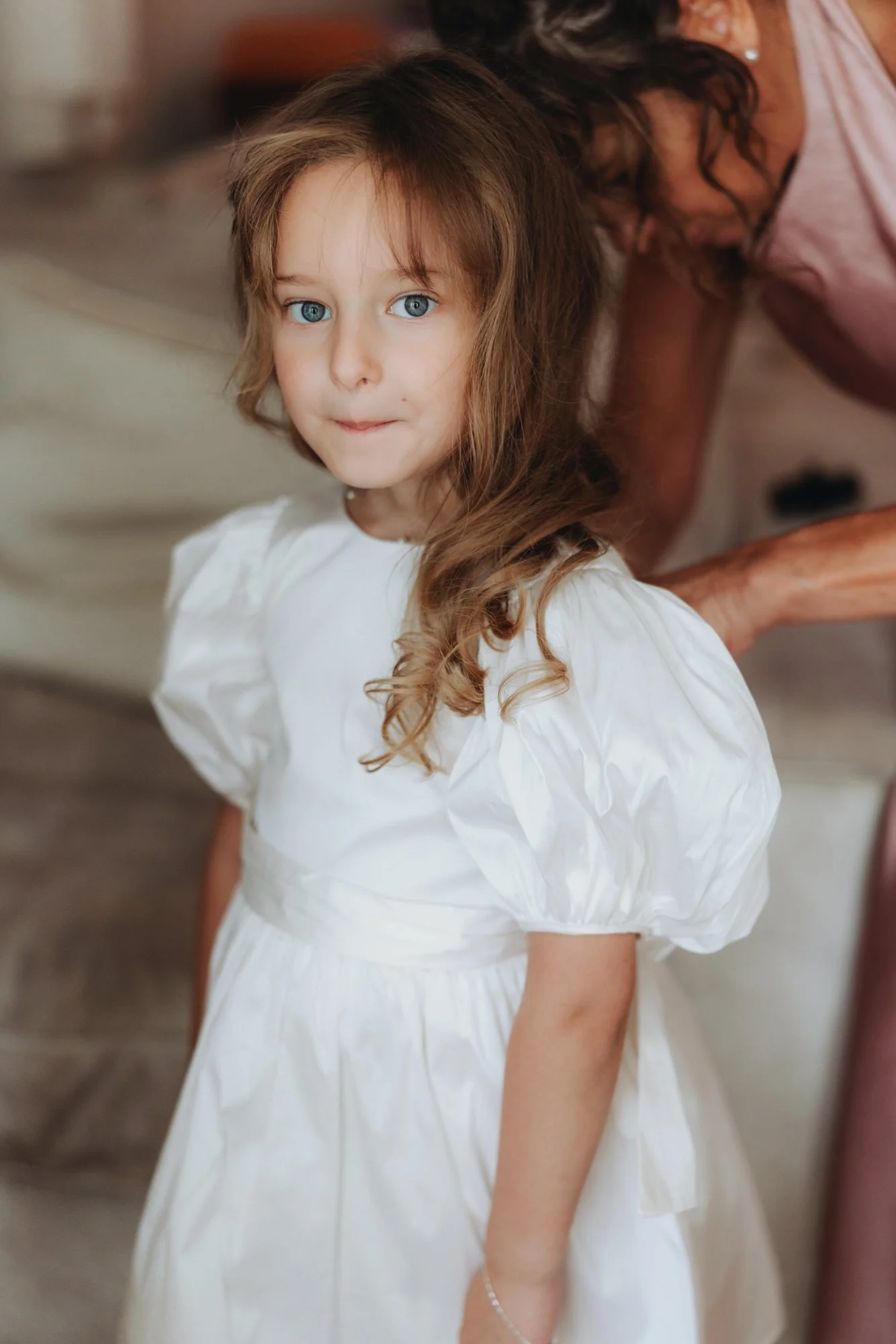 A young flower girl during the wedding morning