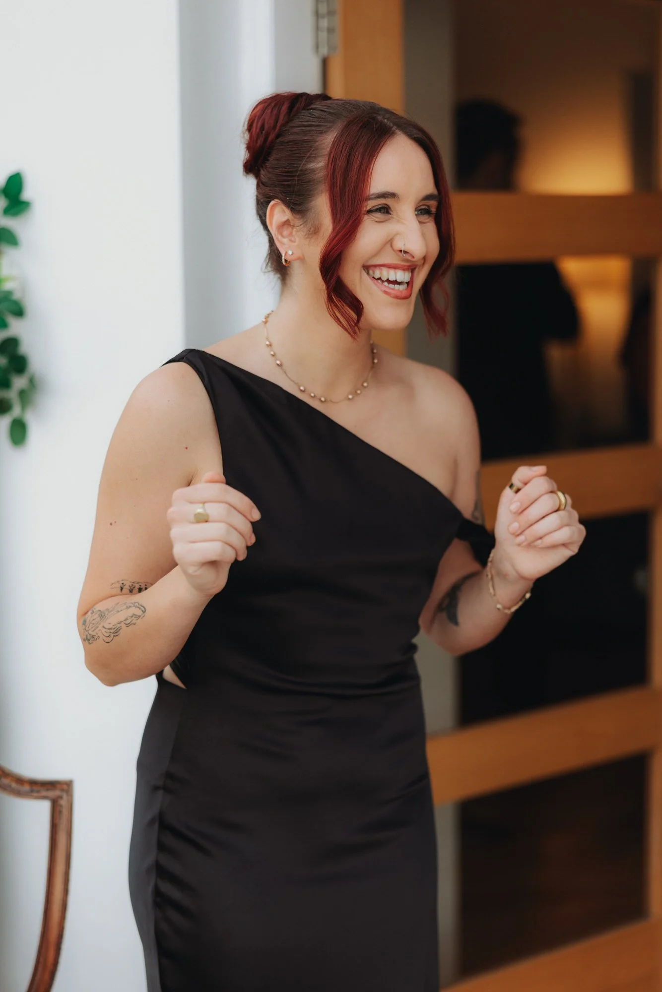 Bridesmaid laughing during the preparations