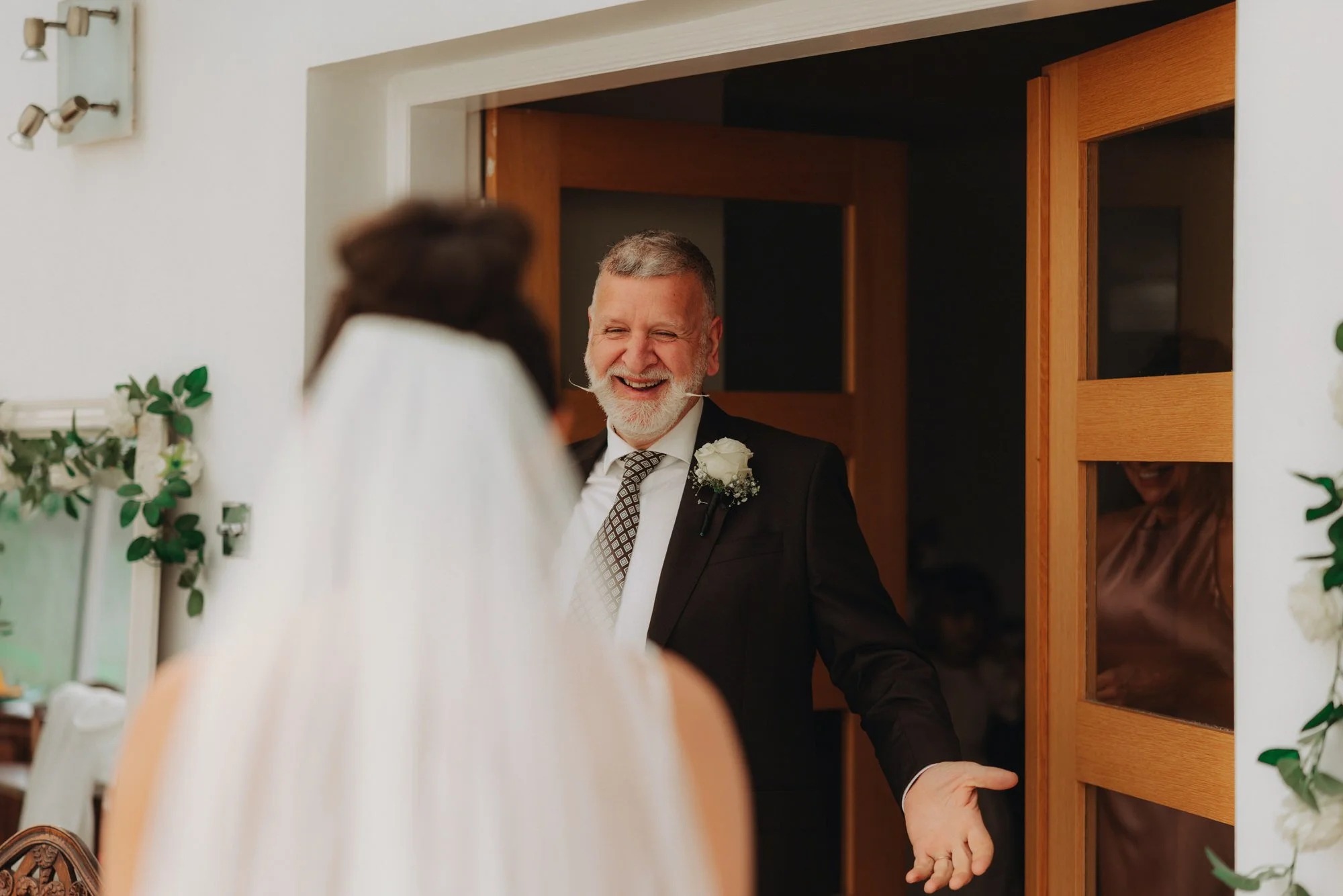 Caterina being greeted in her wedding dress