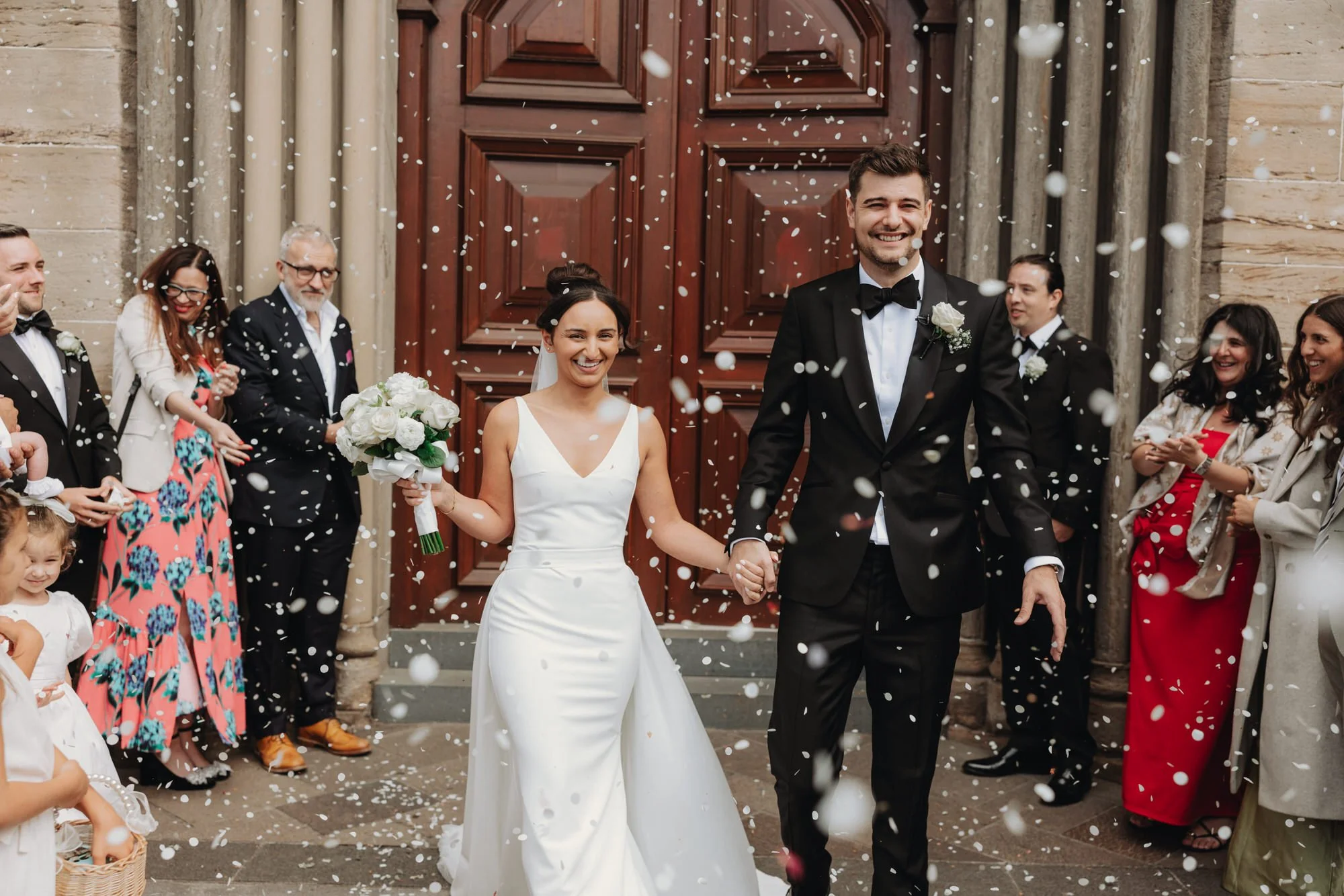 Caterina and Jonathan leaving their Glasgow ceremony through confetti