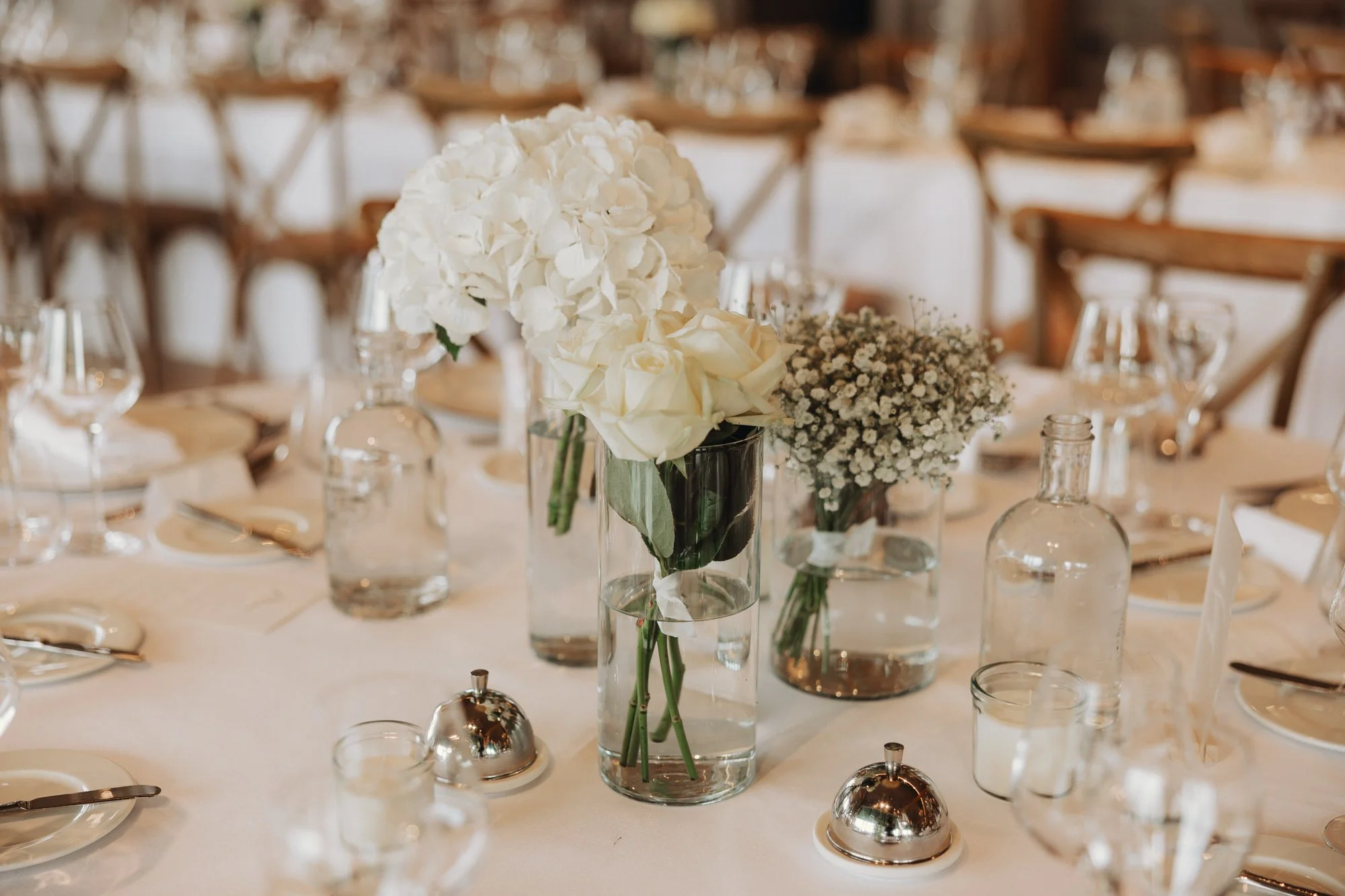 White flowers and glassware on the reception tables