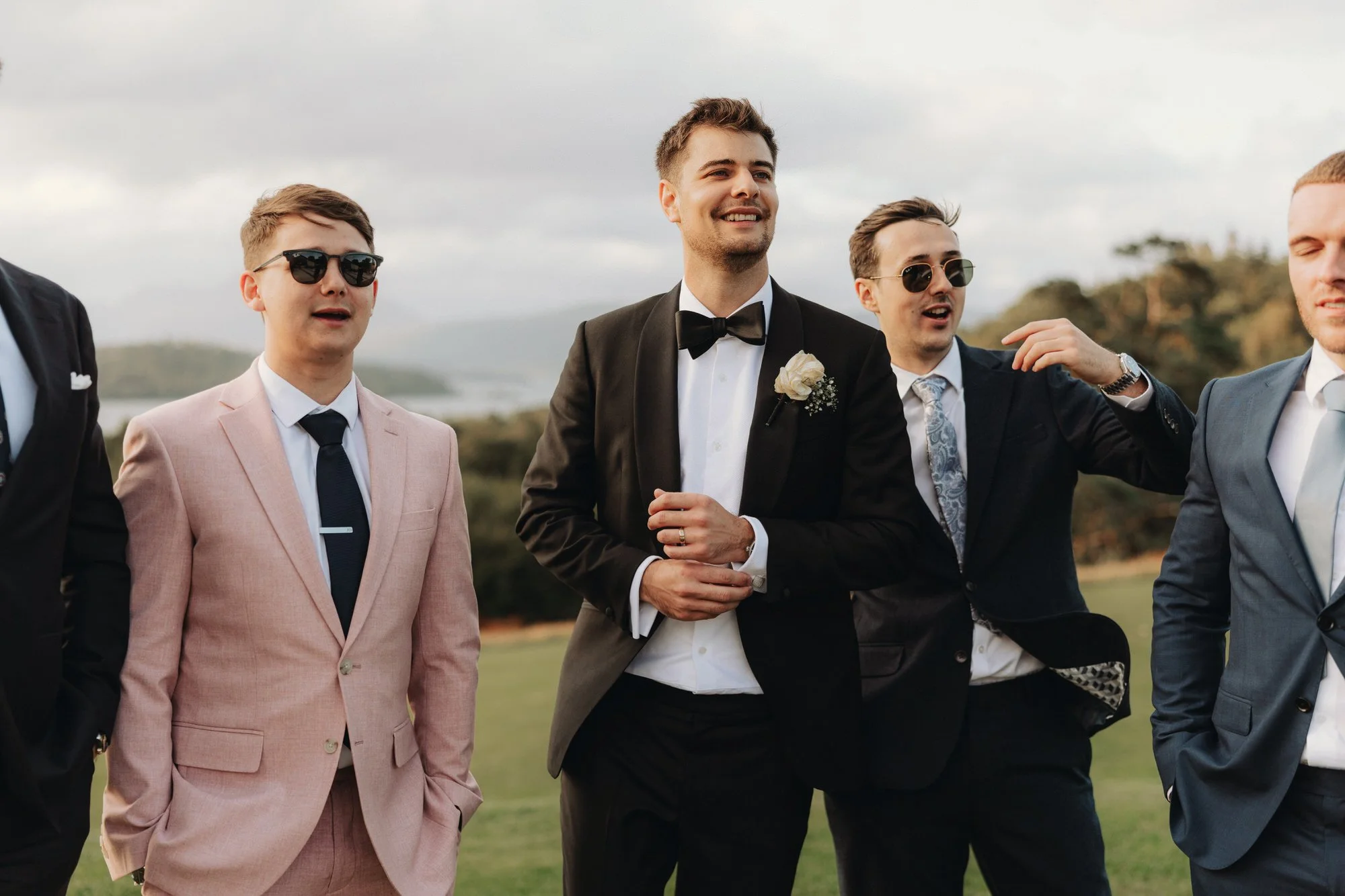 Wedding guests chatting outside with their drinks