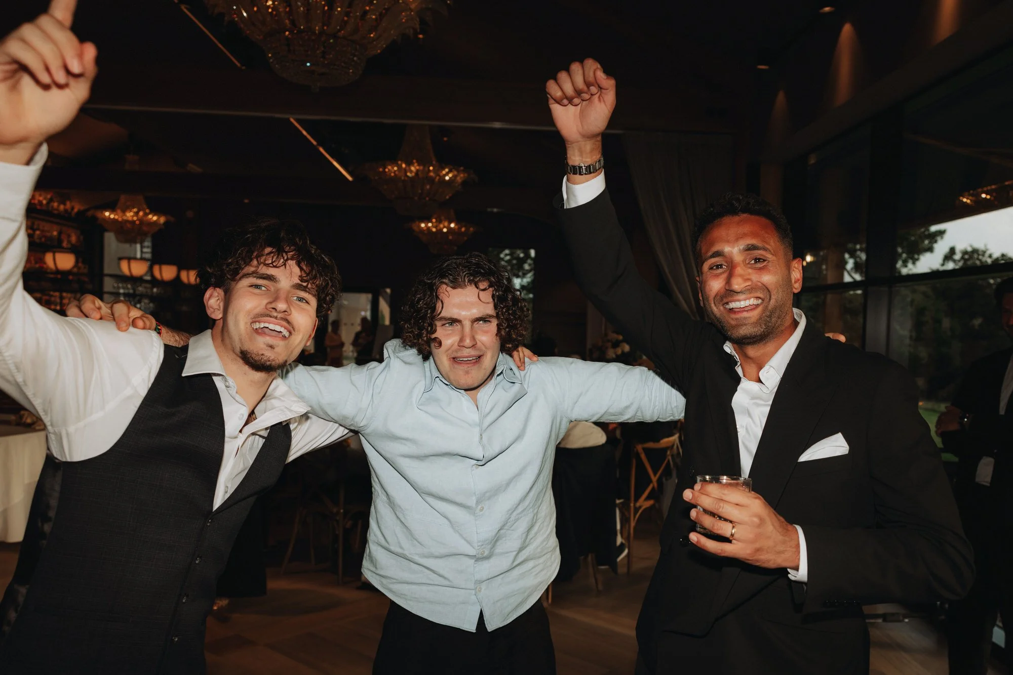 Friends raising glasses during the evening celebration