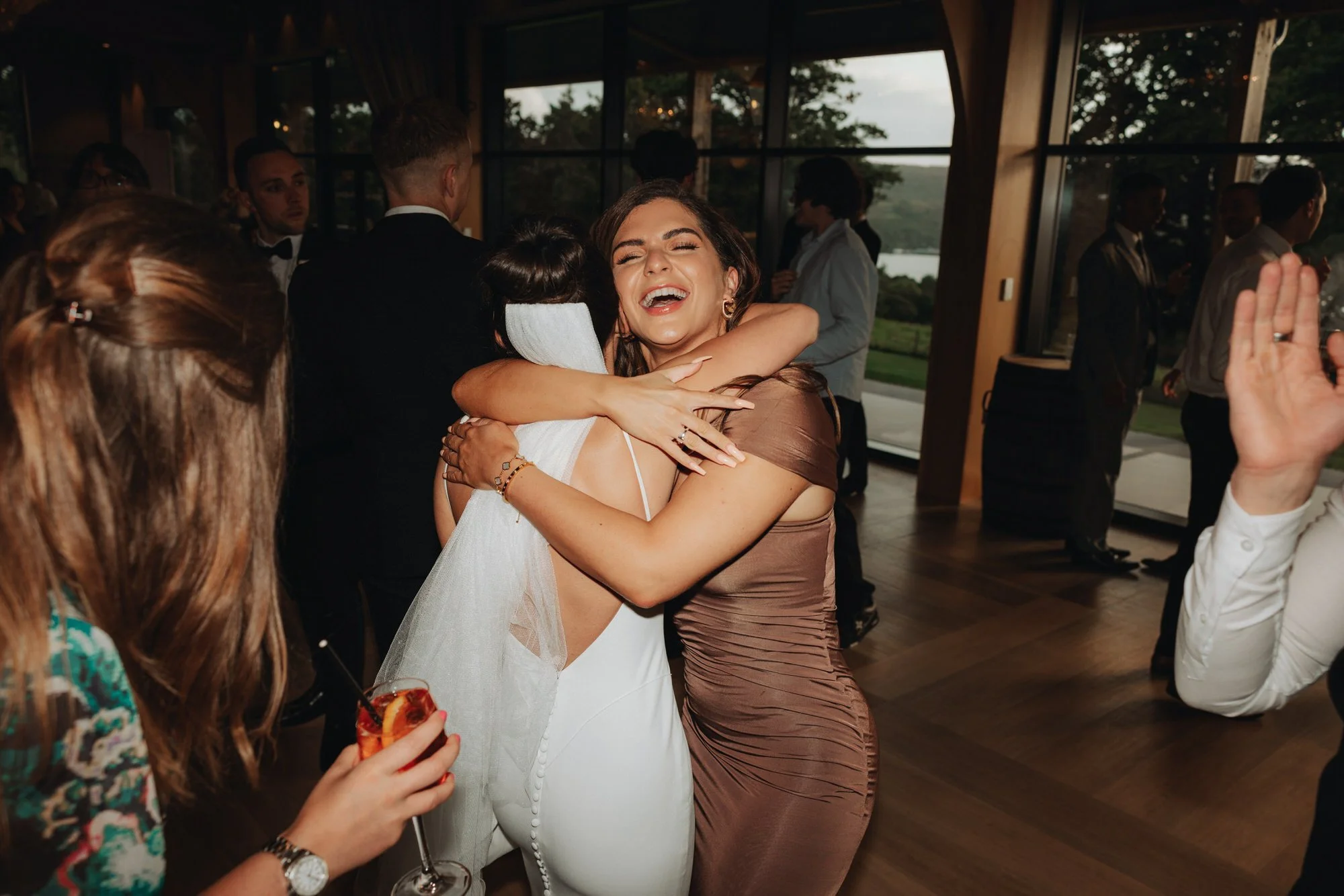 Caterina hugging a friend on the dance floor