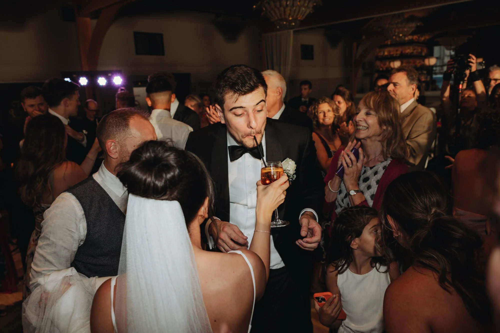 The couple and guests enjoying the evening party