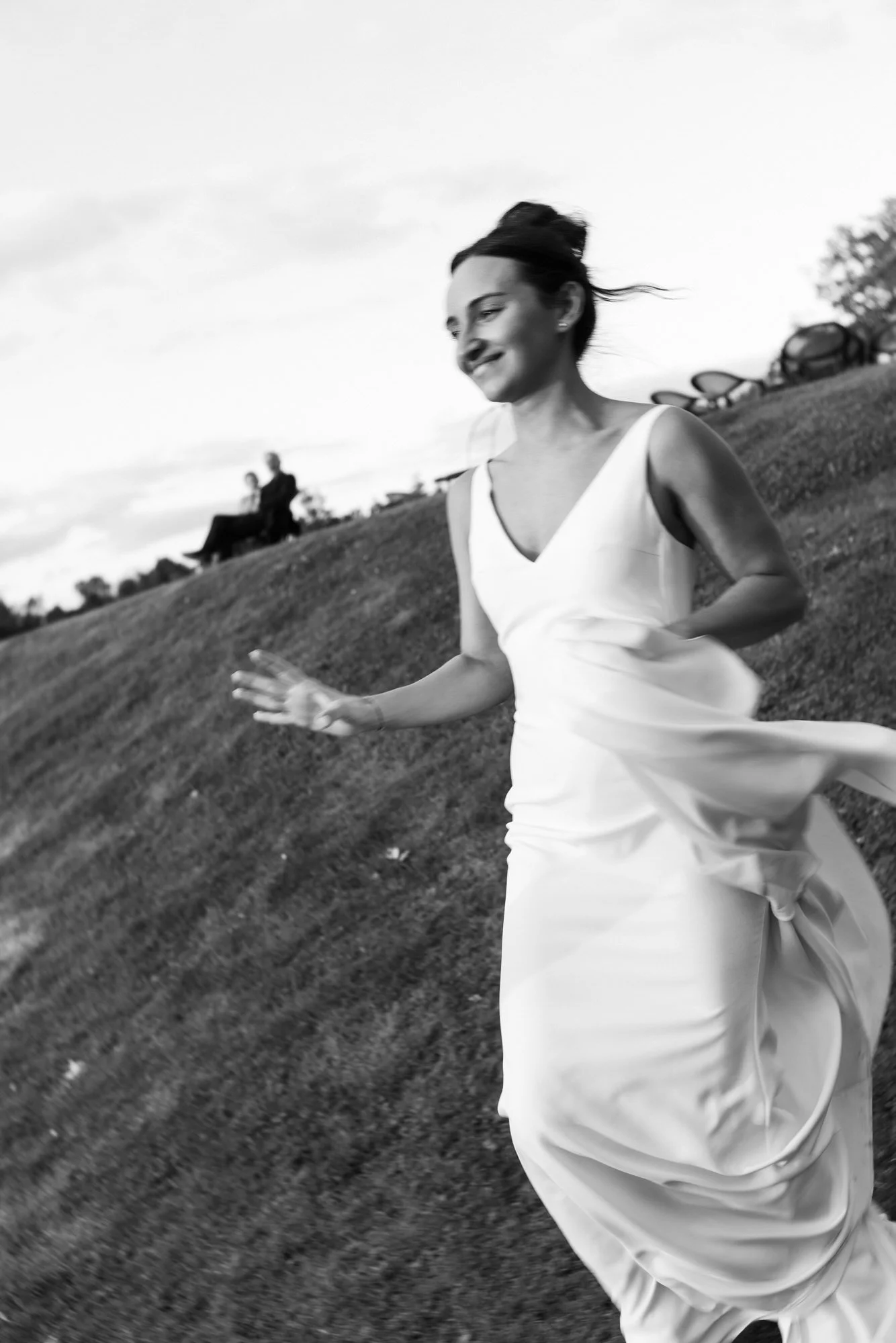 Caterina walking across the lawn in the evening