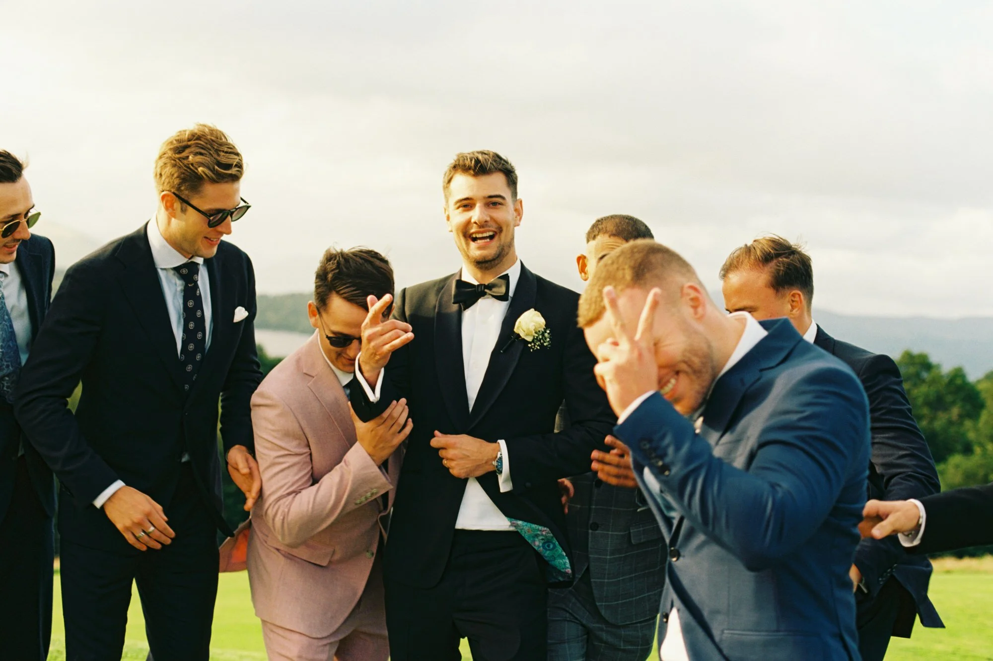 Jonathan laughing with friends outside the pavilion