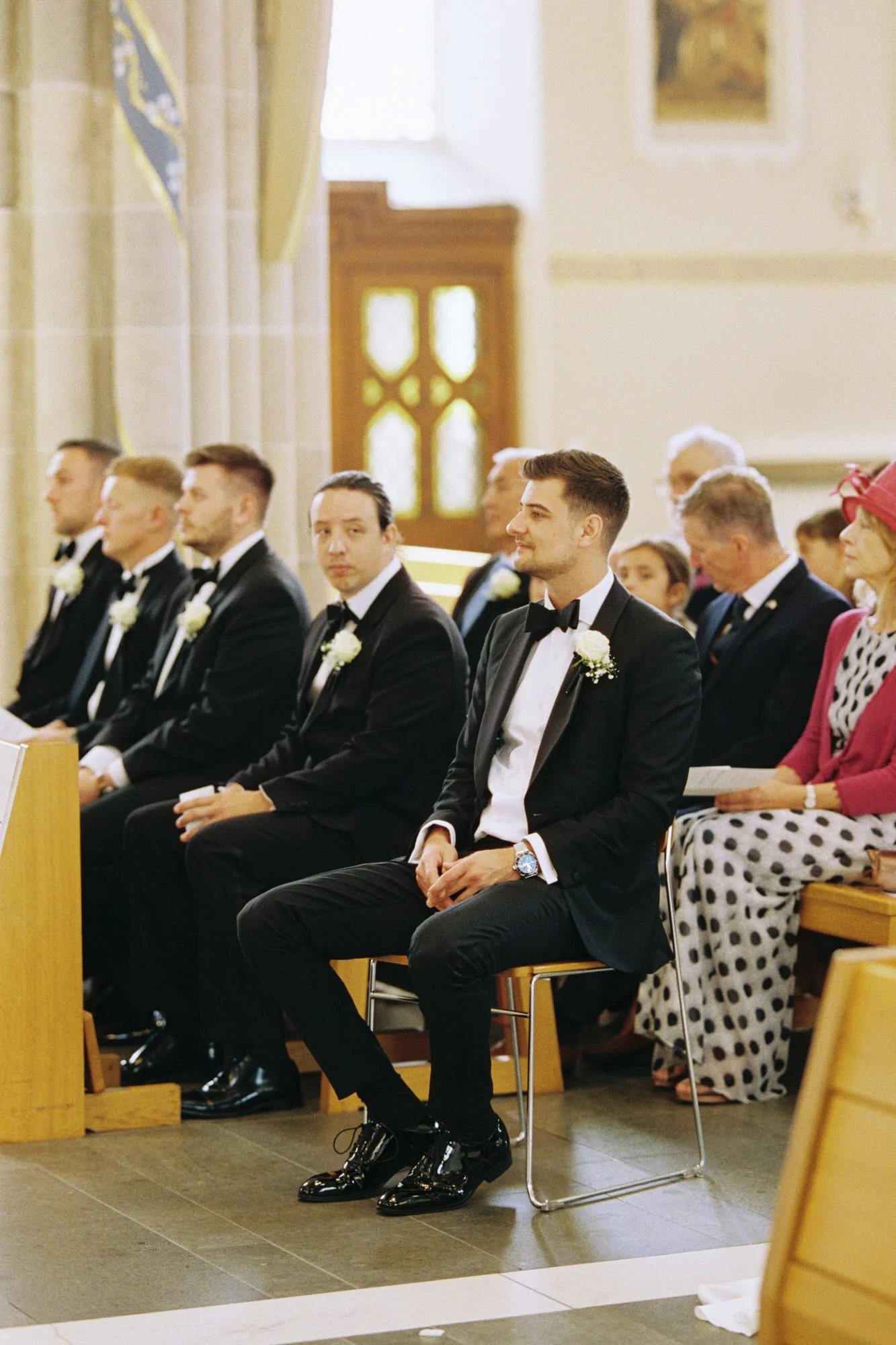 Jonathan and his groomsmen seated inside St Andrew’s Cathedral