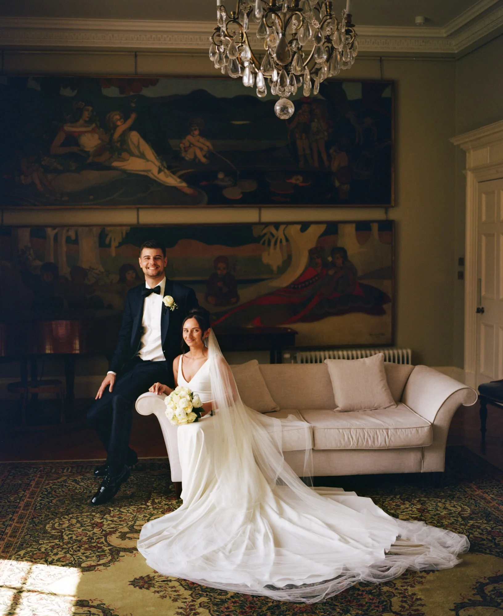 The couple beneath the painting in Boturich’s drawing room