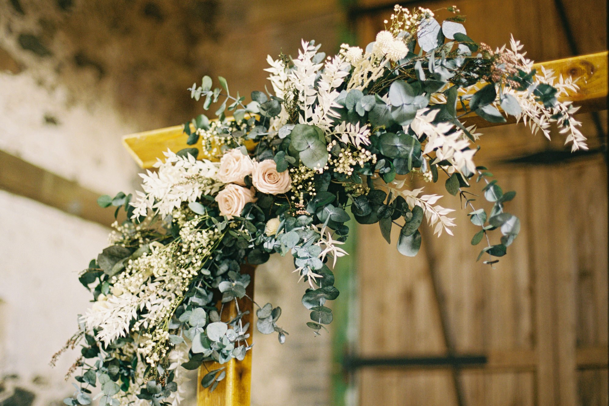 Dried floral arrangement inside the wedding ceremony barn