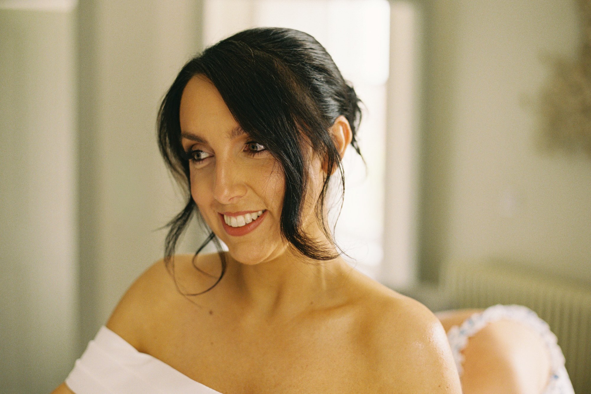 Claire smiling during her wedding morning preparations
