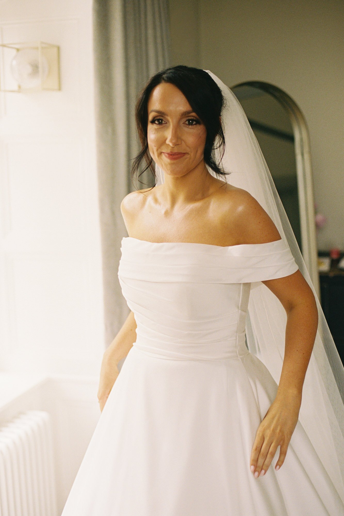 Bride in an off-the-shoulder dress at Pratis House