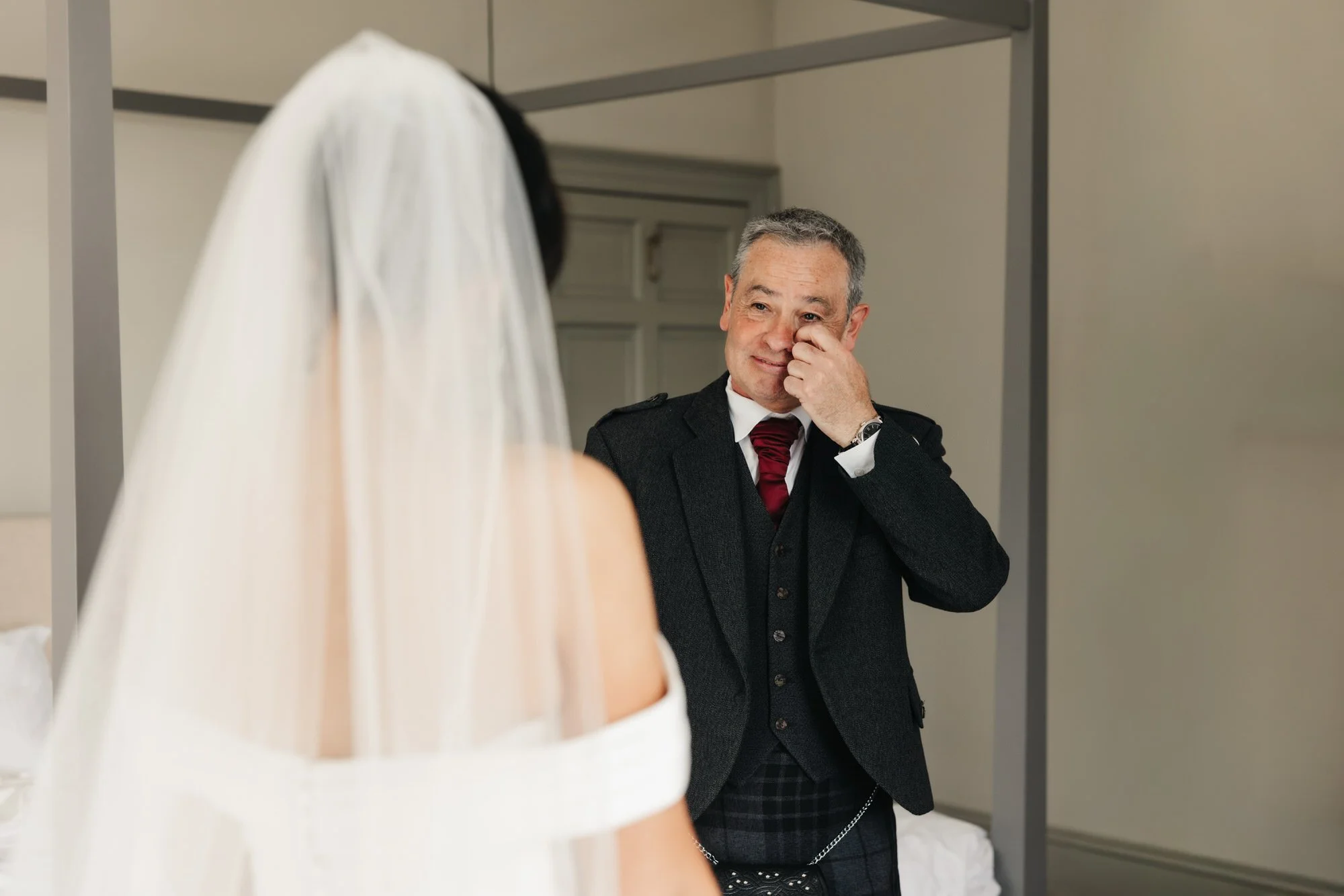 A guest reacting to Claire in her wedding dress
