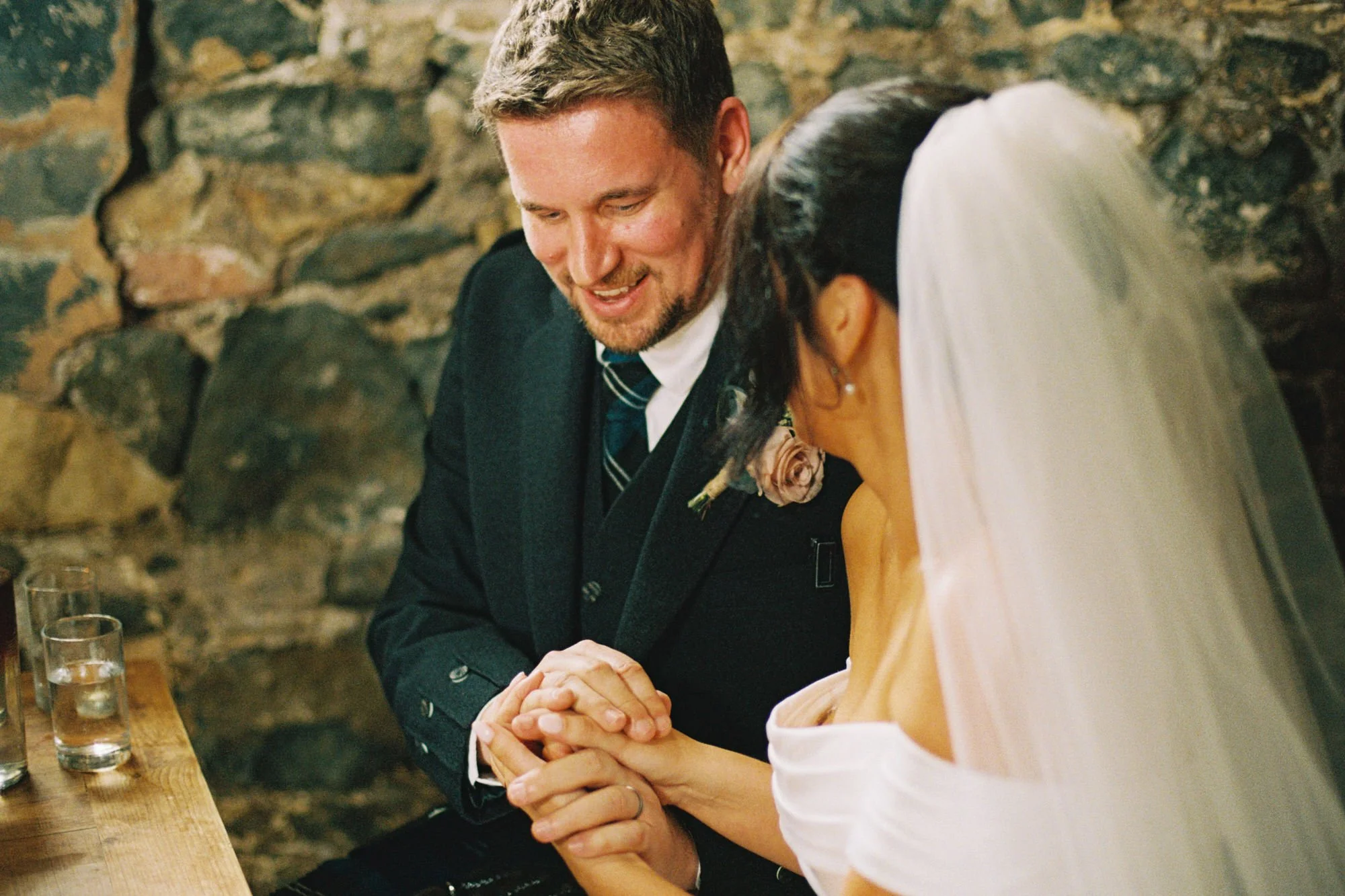 Newlyweds smiling together after exchanging vows