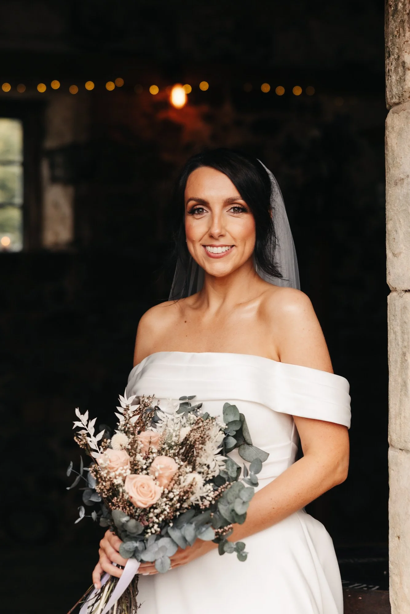 Portrait of Claire holding her dried flower bouquet