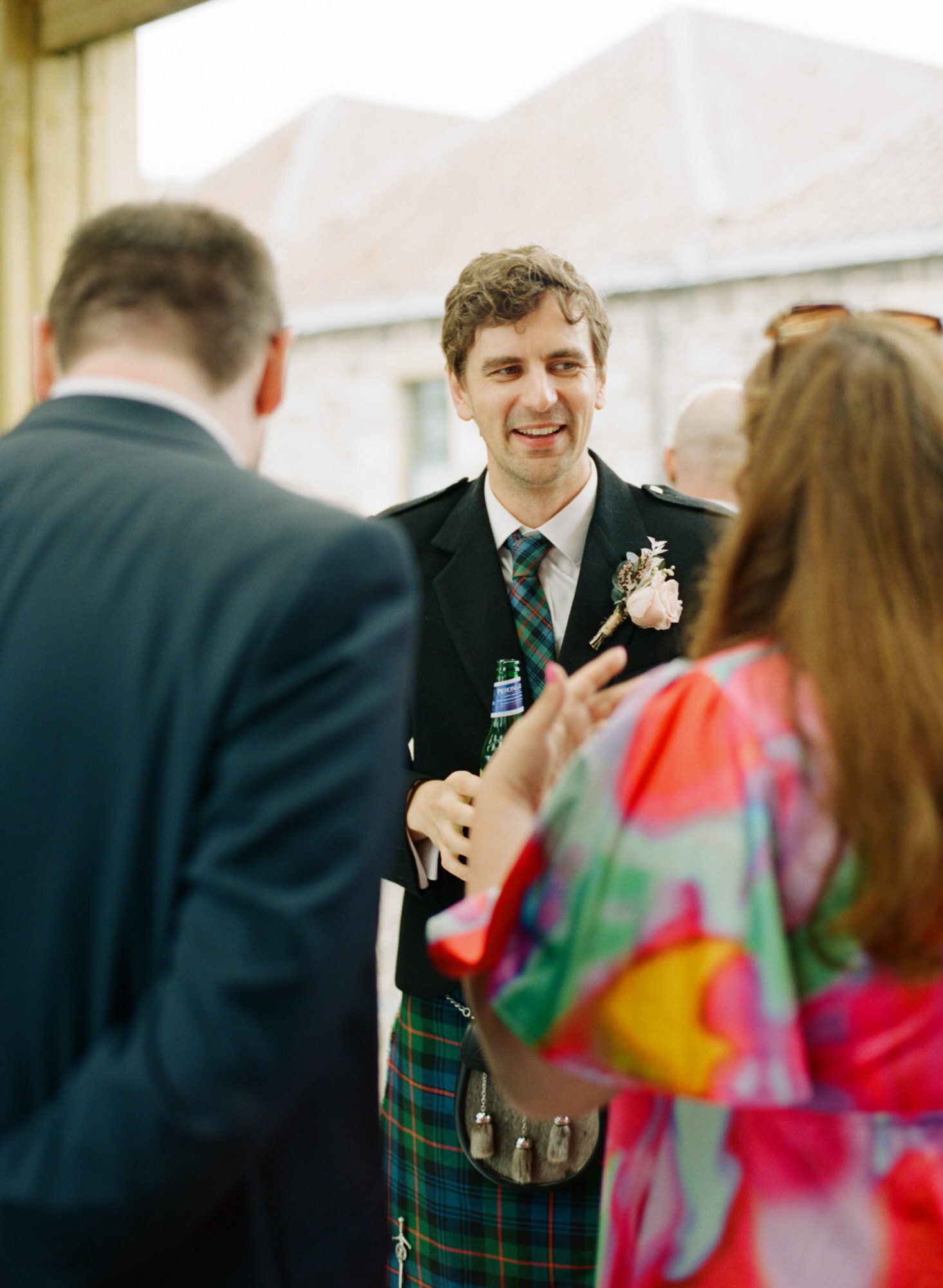 Groom talking with guests during the drinks reception