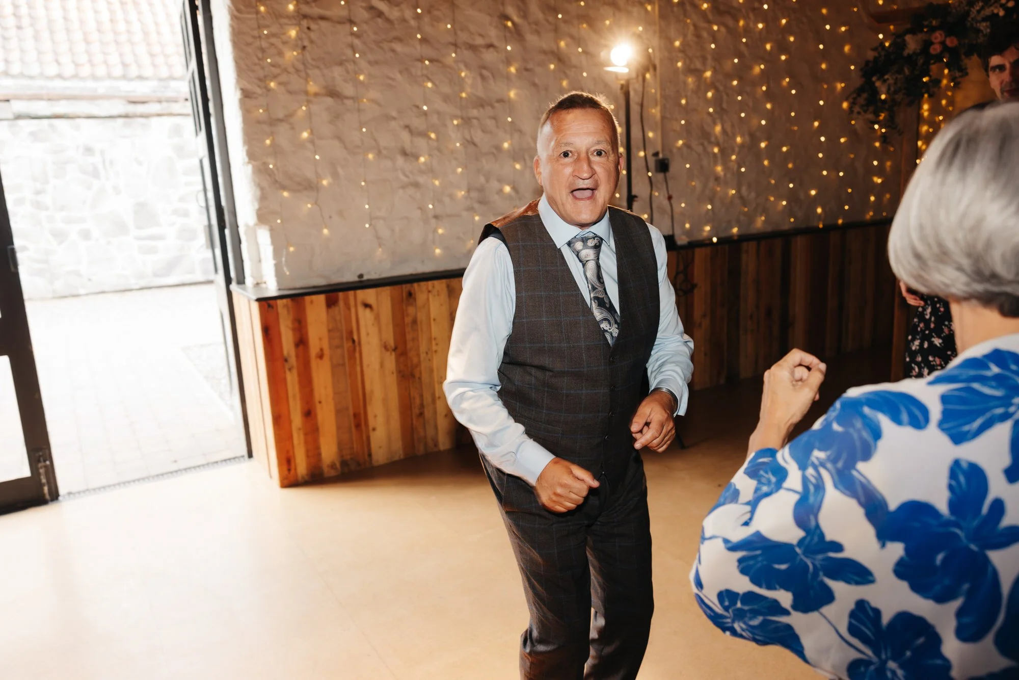 Guest smiling on the dance floor at Pratis Barns