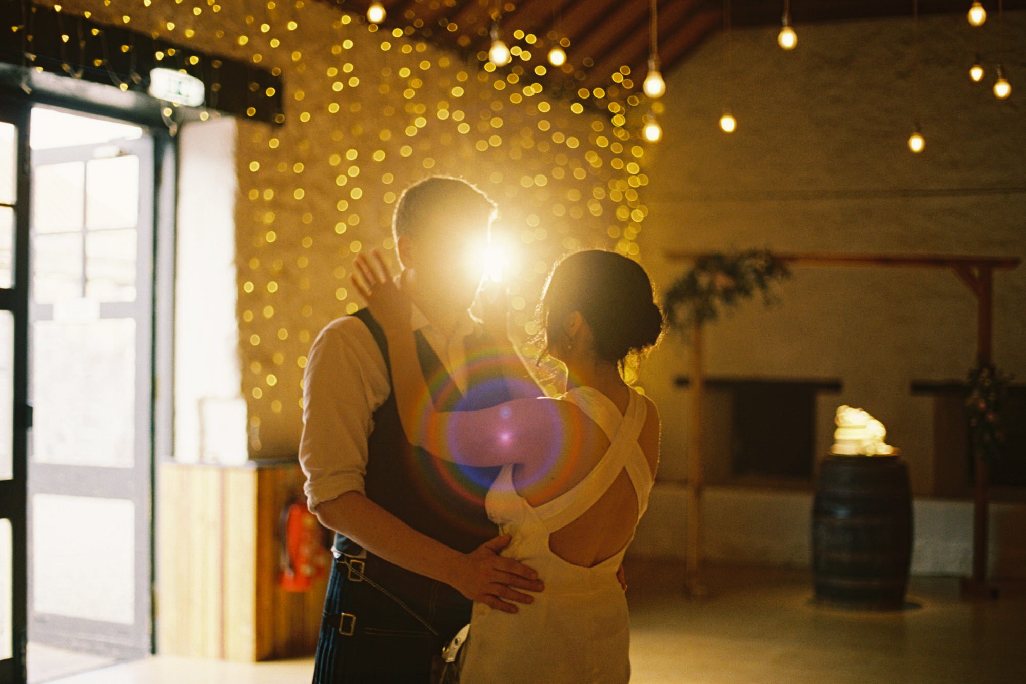 Backlit photograph of the couple dancing together