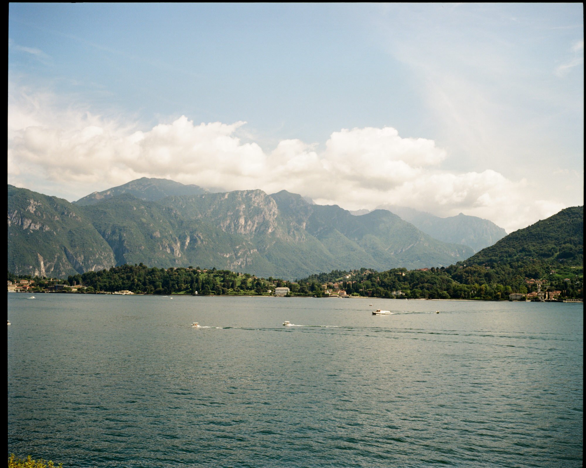 A wide view across Lake Como towards the mountains