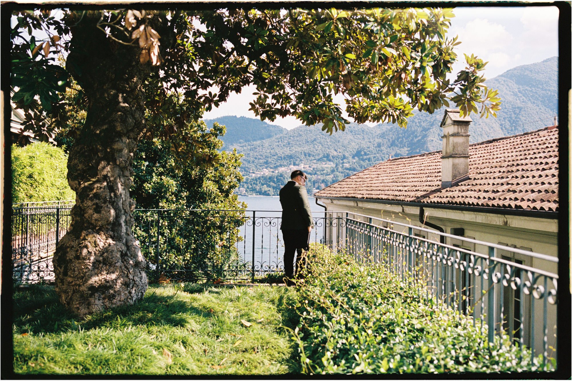 Dan waiting in the shaded gardens above the lake