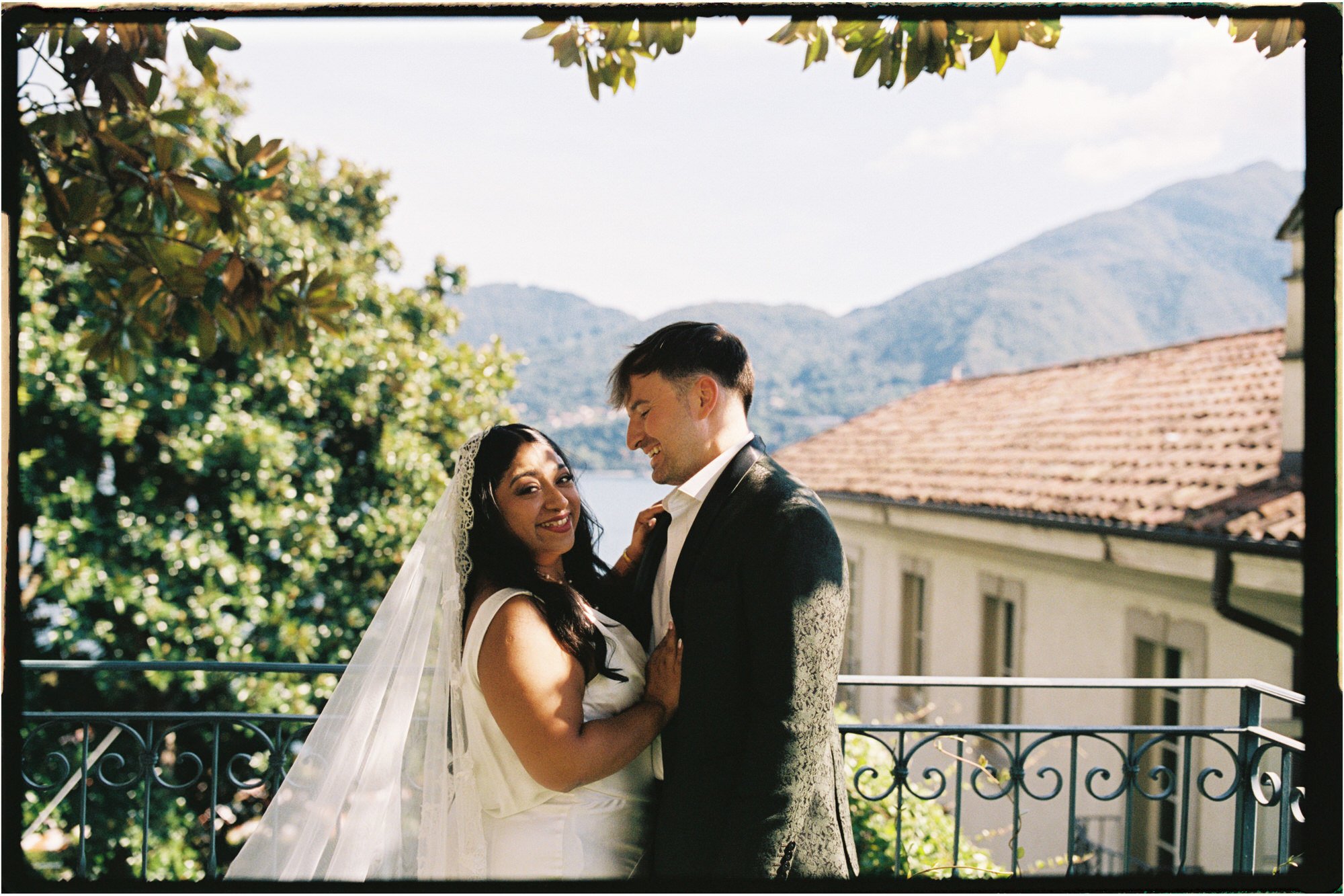 Velia and Dan facing each other beneath a tree
