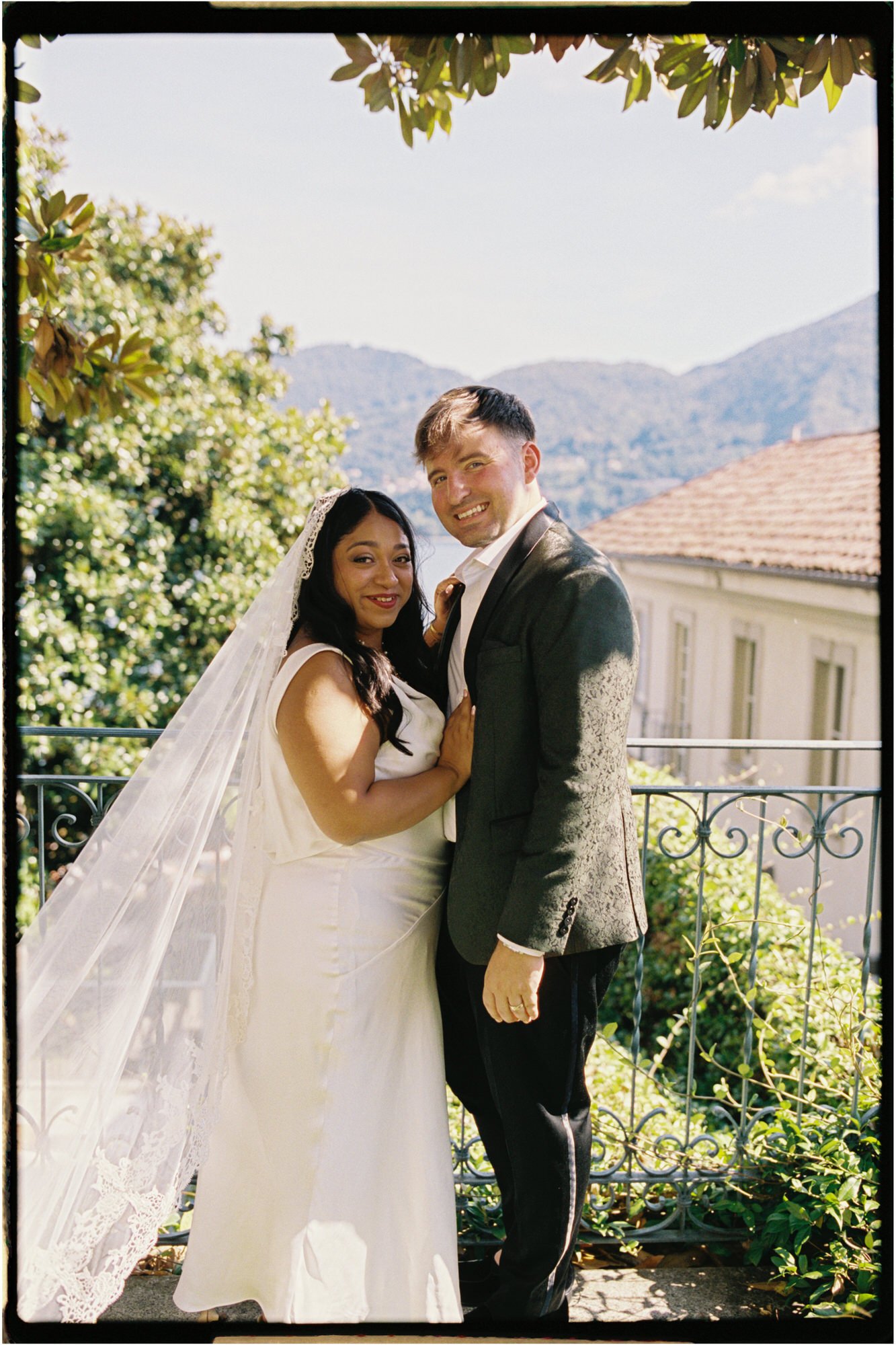 Velia and Dan holding hands in the garden