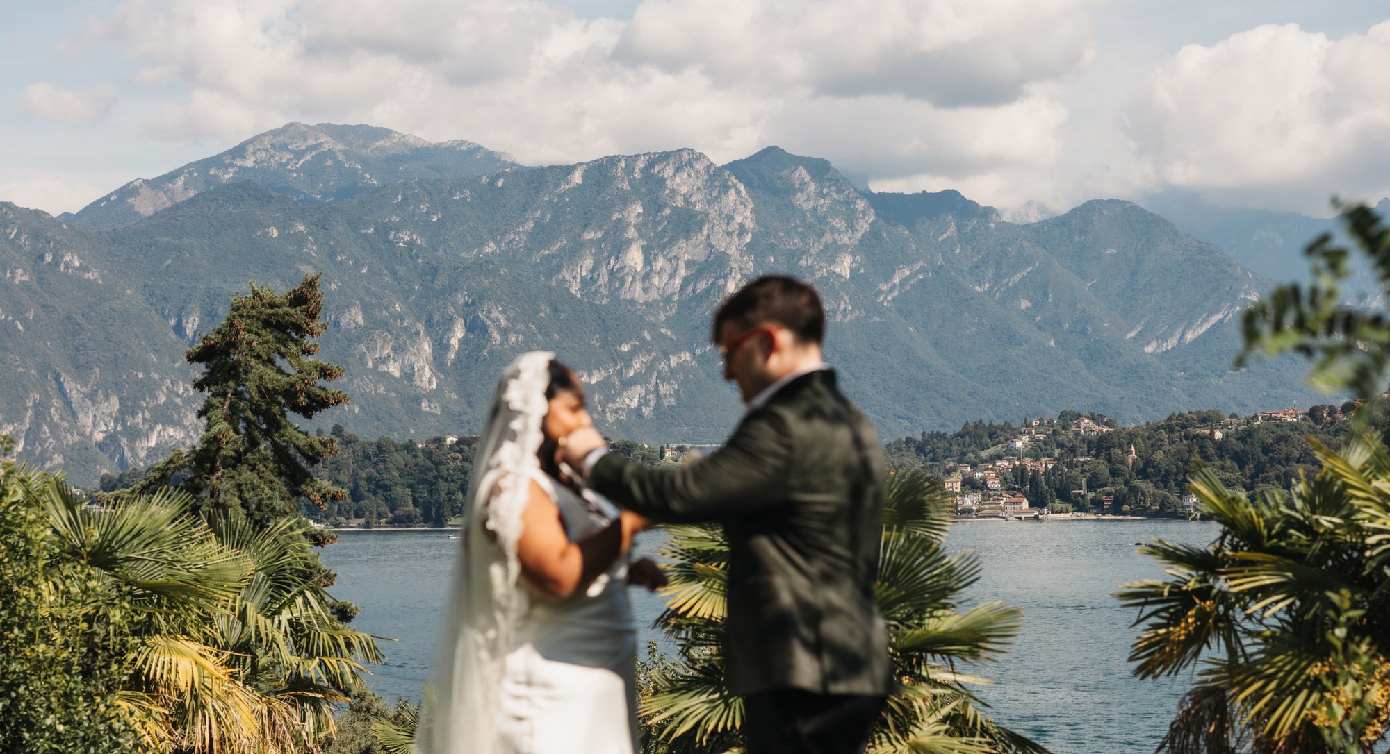 Dan lifting Velia’s veil with mountains behind them