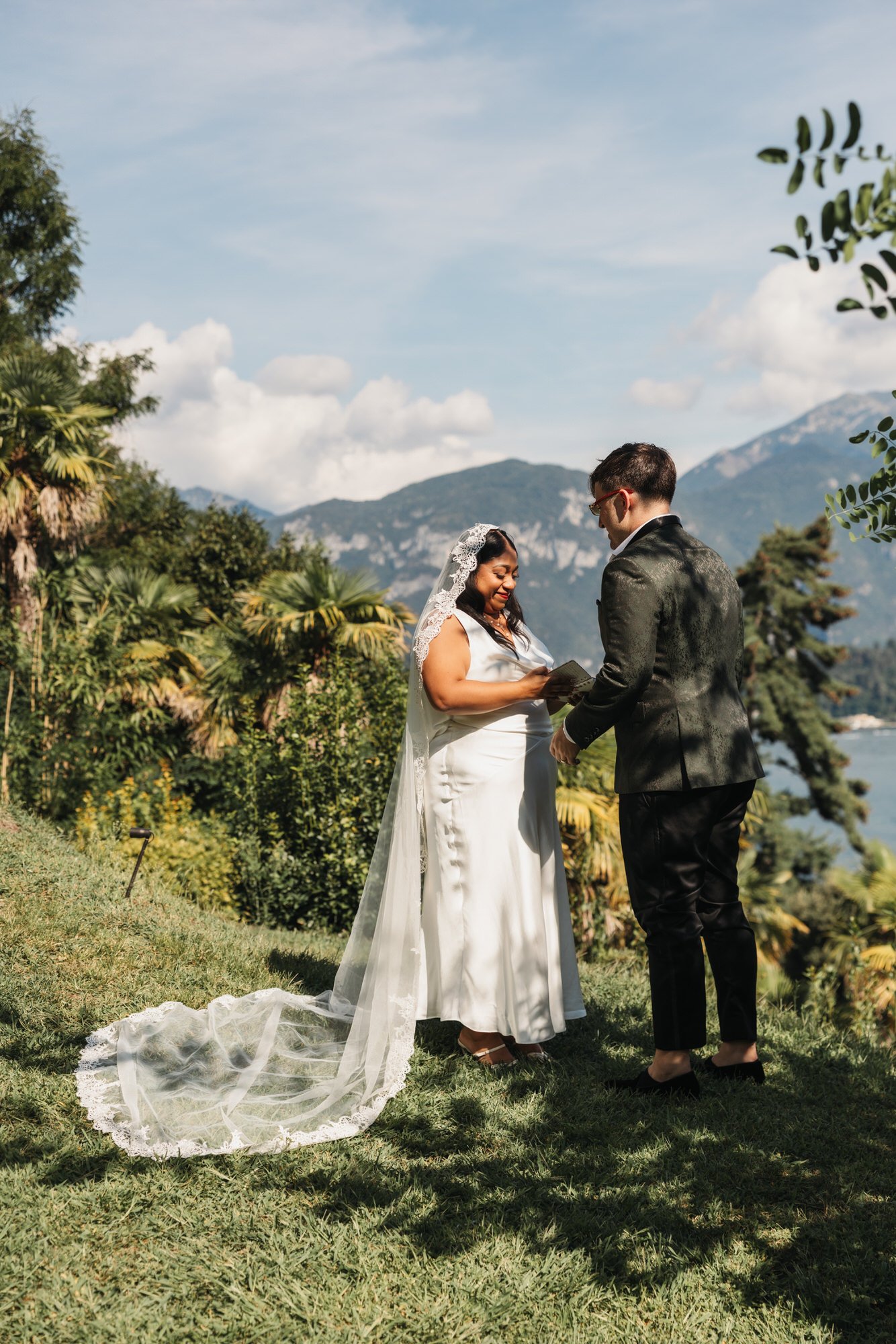 The couple exchanging vows in the sunshine