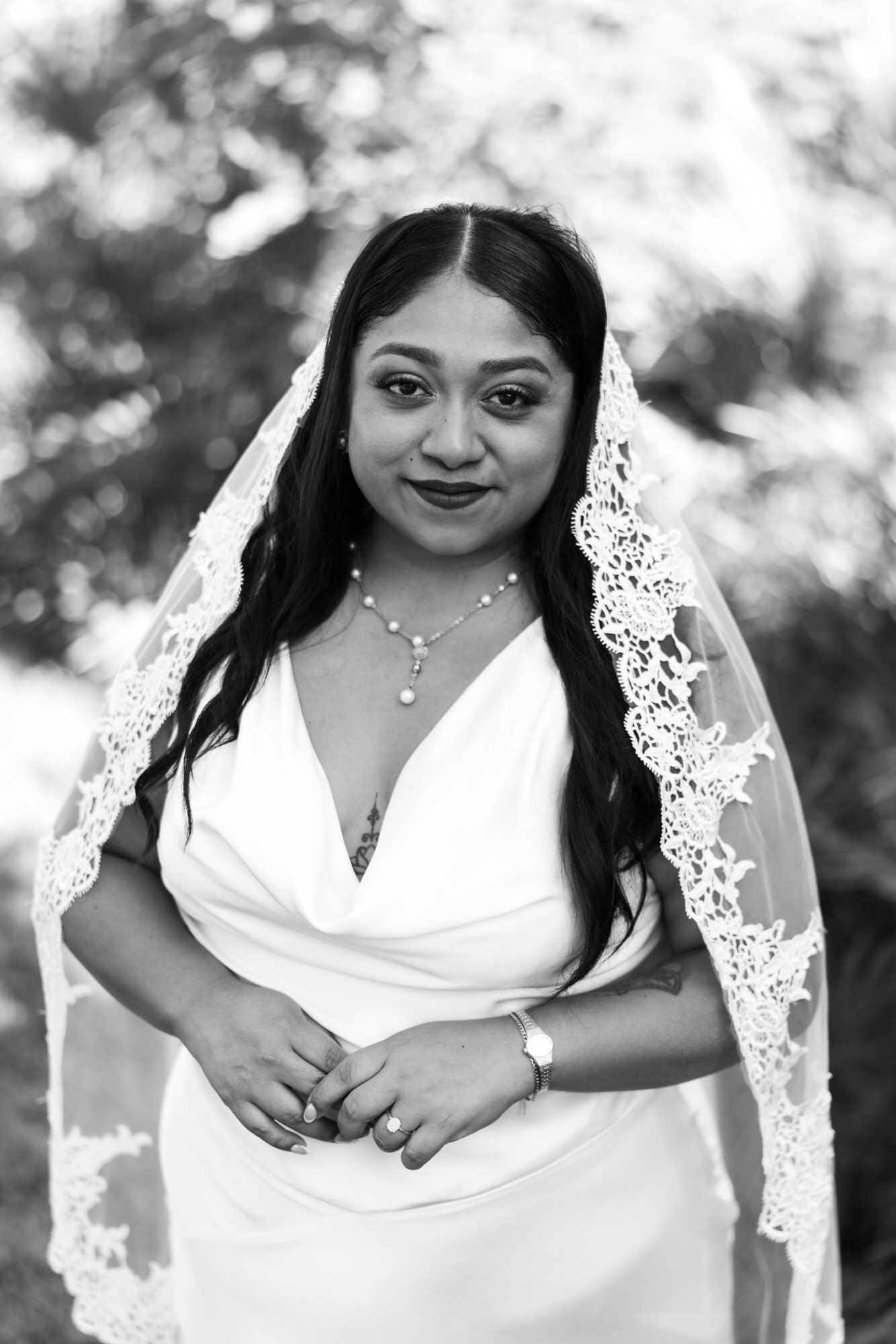 A black and white portrait of Velia in the garden
