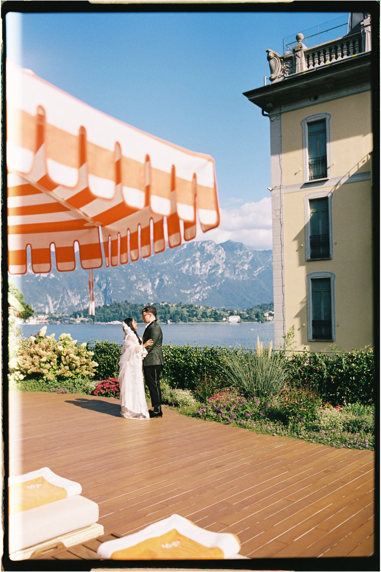 Velia beneath the orange and white parasols
