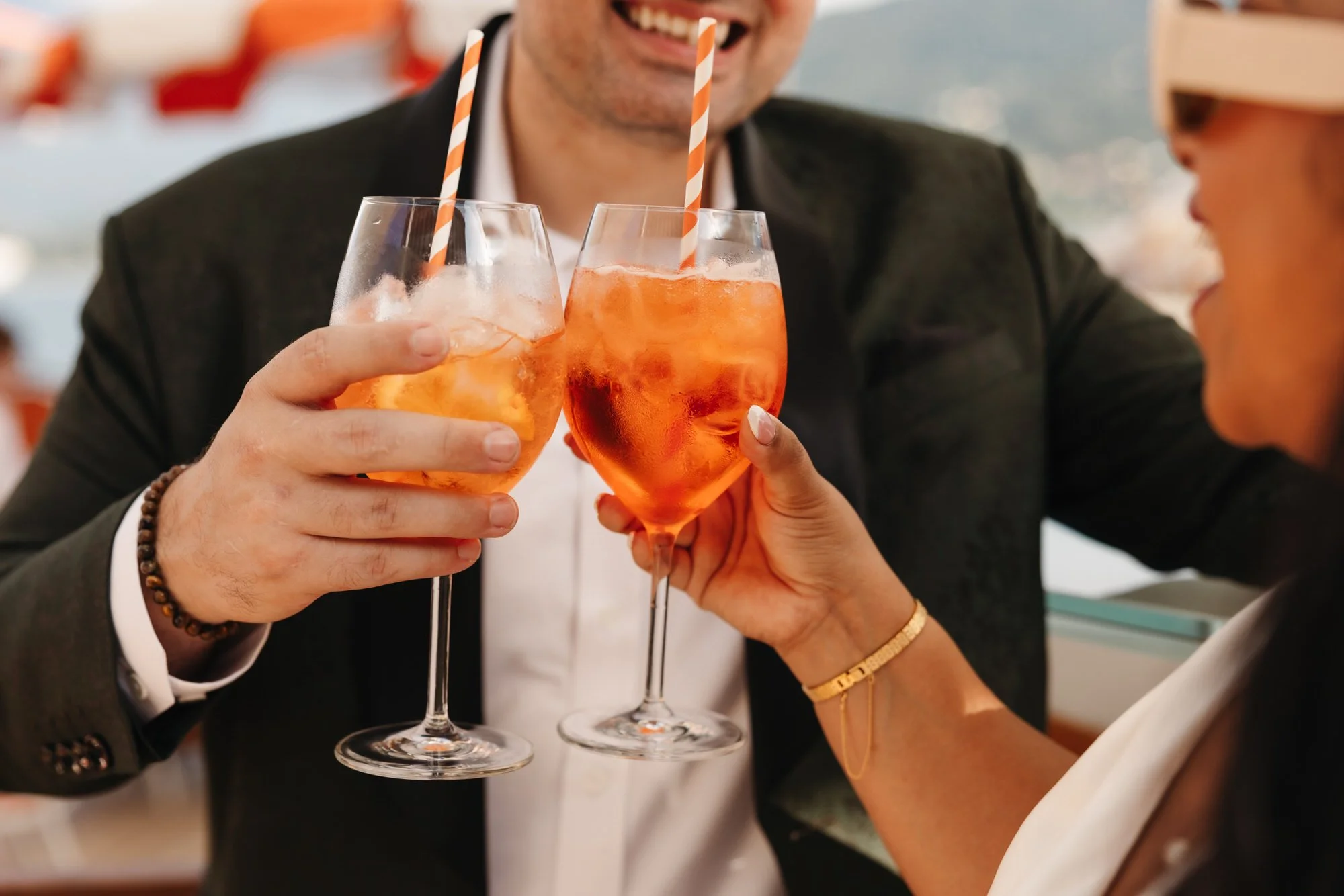 A close view of the couple raising their glasses