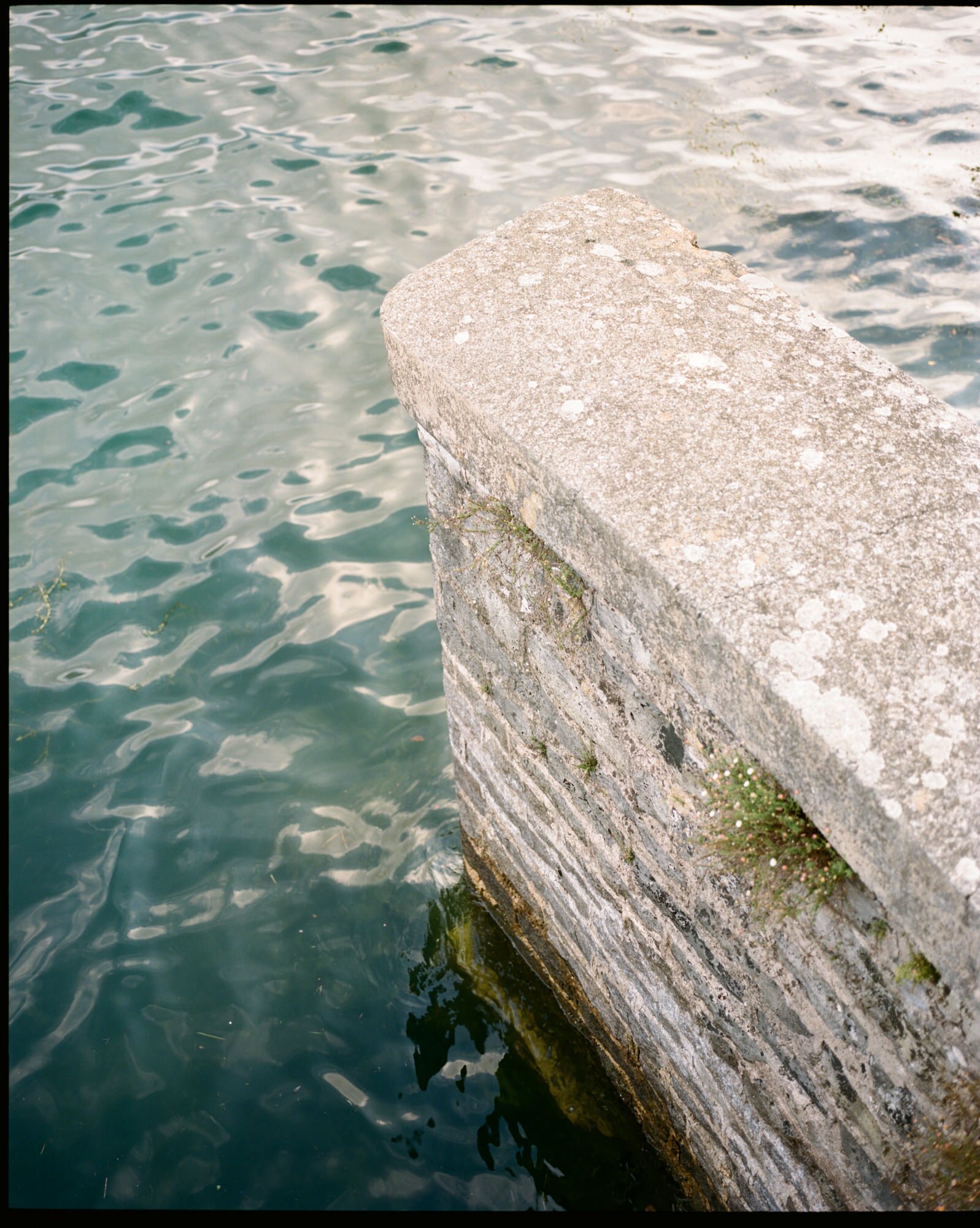 Lake water beside the stone jetty