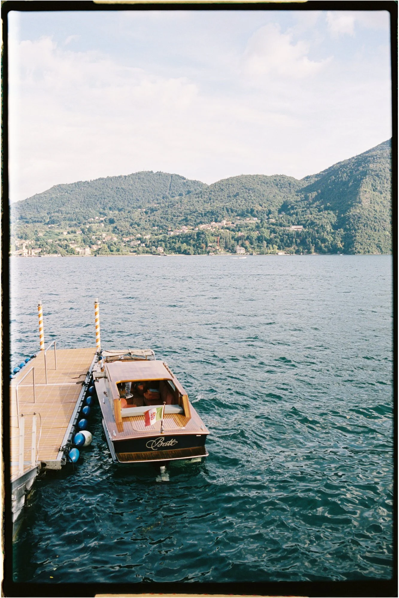 A traditional wooden boat arriving at the jetty