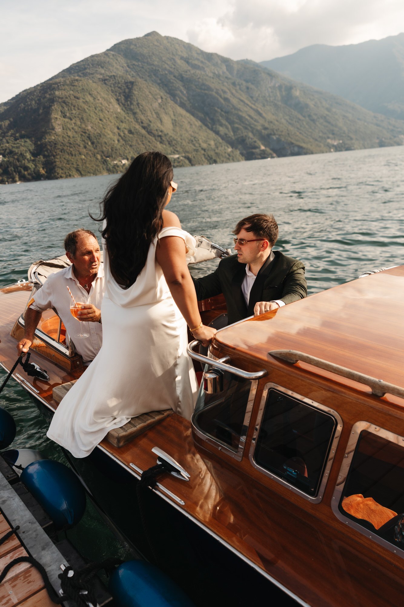 Velia and Dan boarding the wooden boat