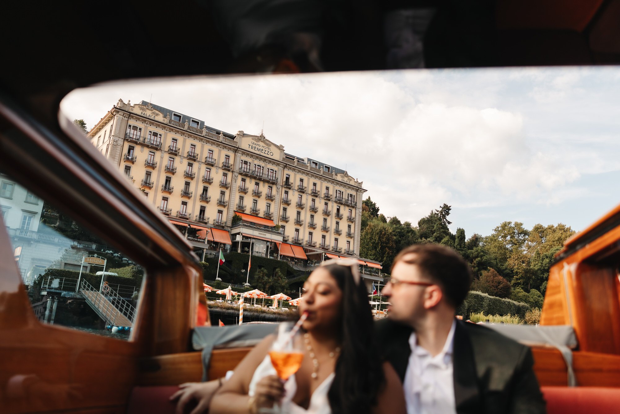 The couple relaxing aboard the wooden boat