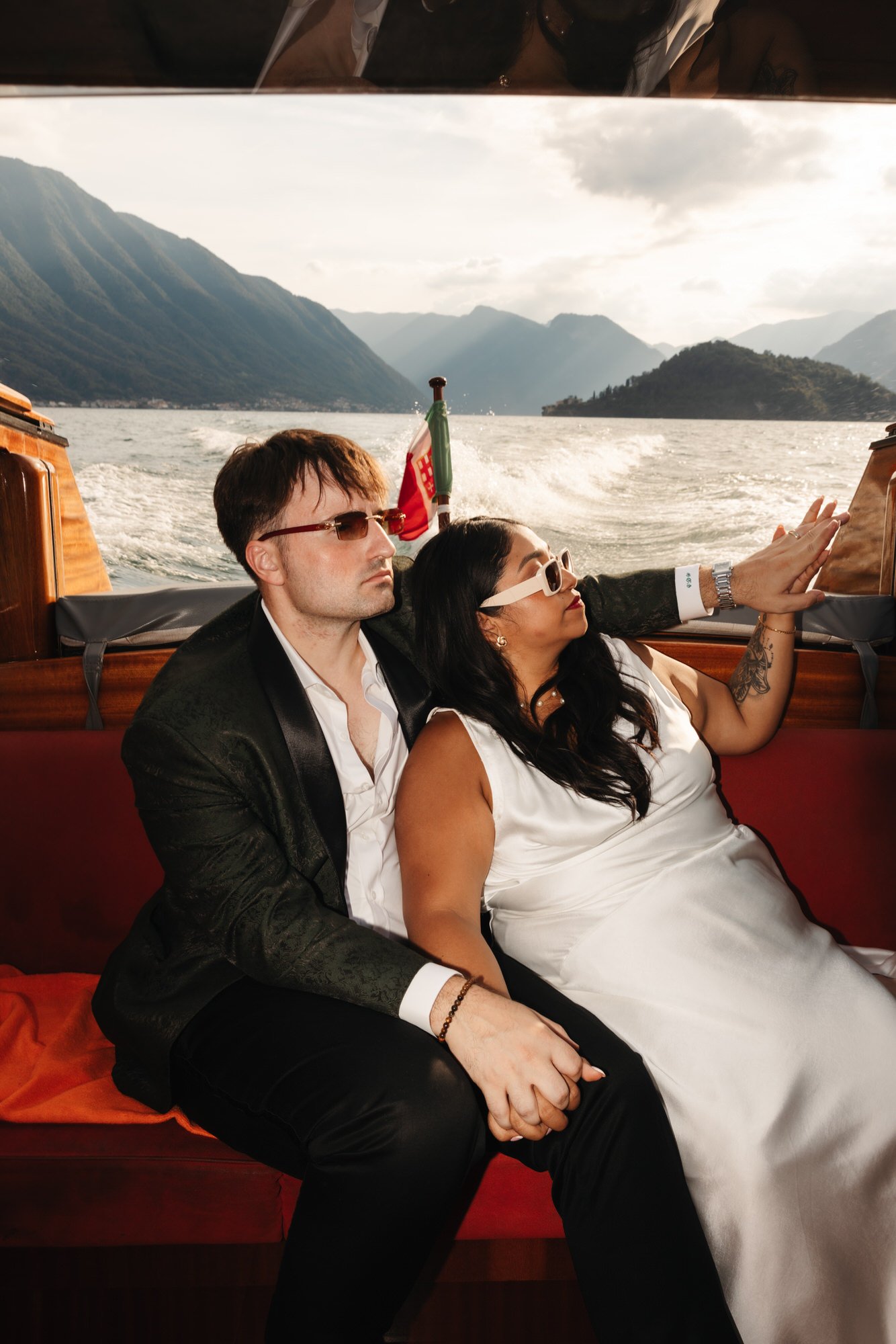 The couple sitting together during their sunset boat trip