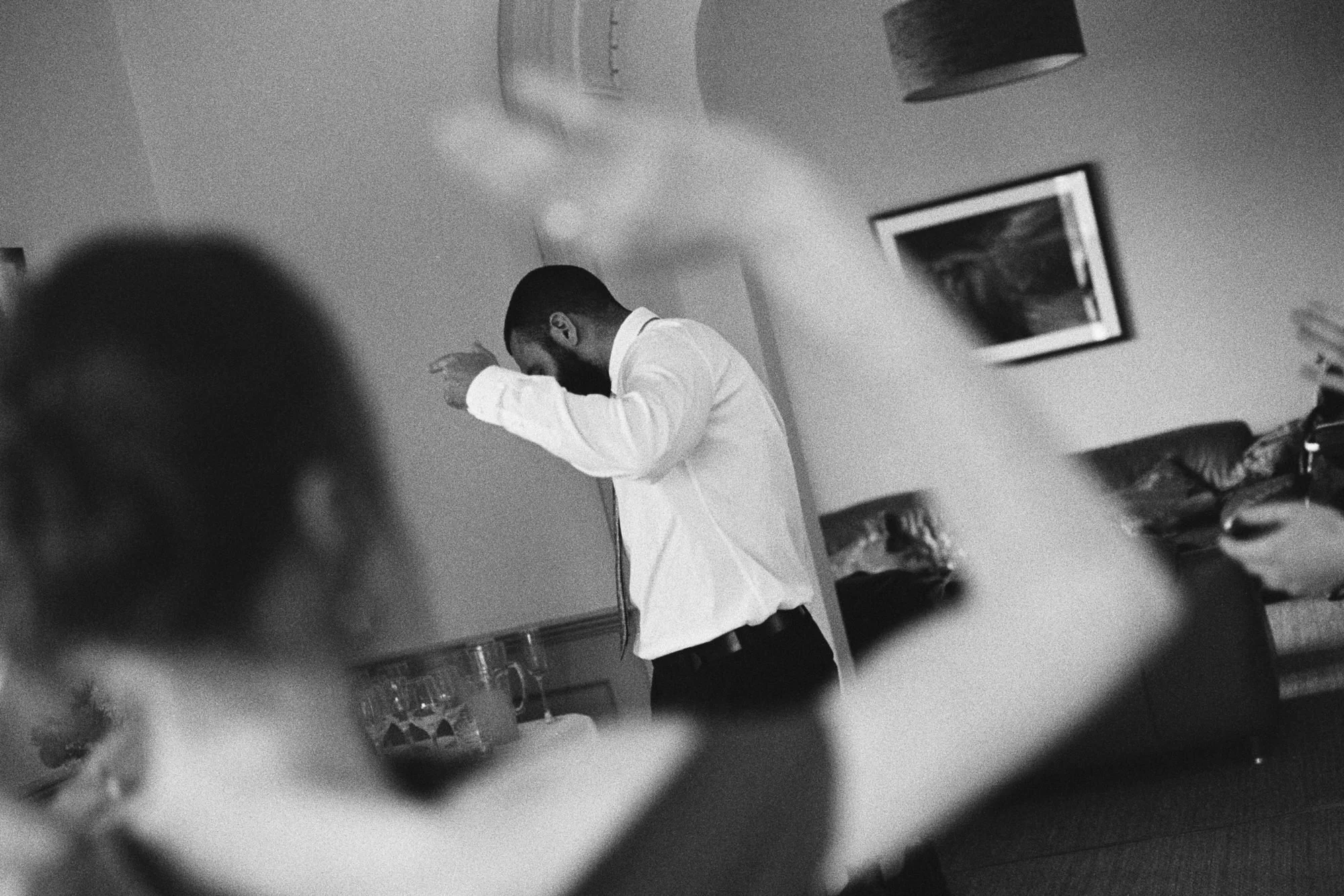 analog film photo in black and white of people dancing at wedding