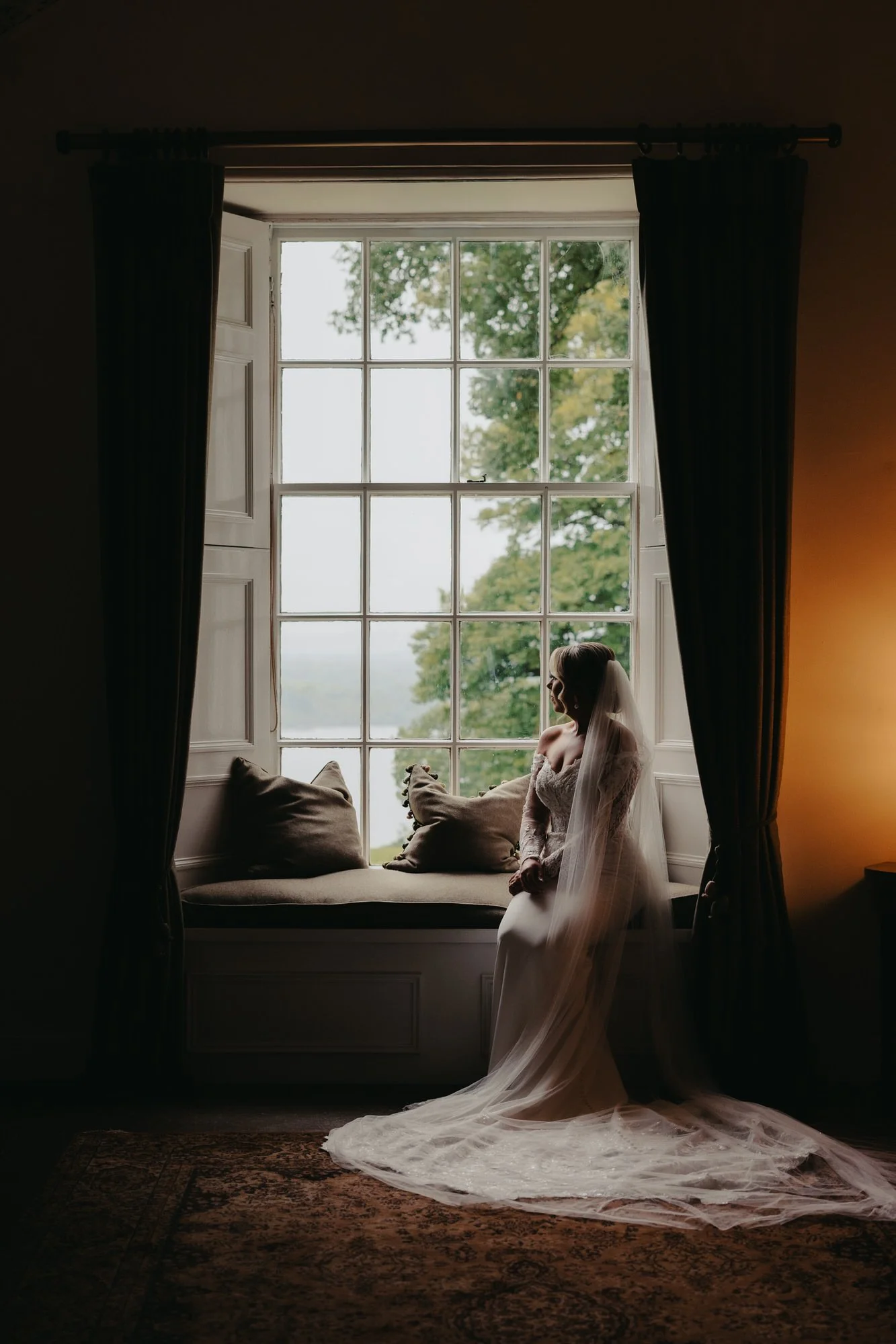 portrait of a bride seated at a window in Scottish castle