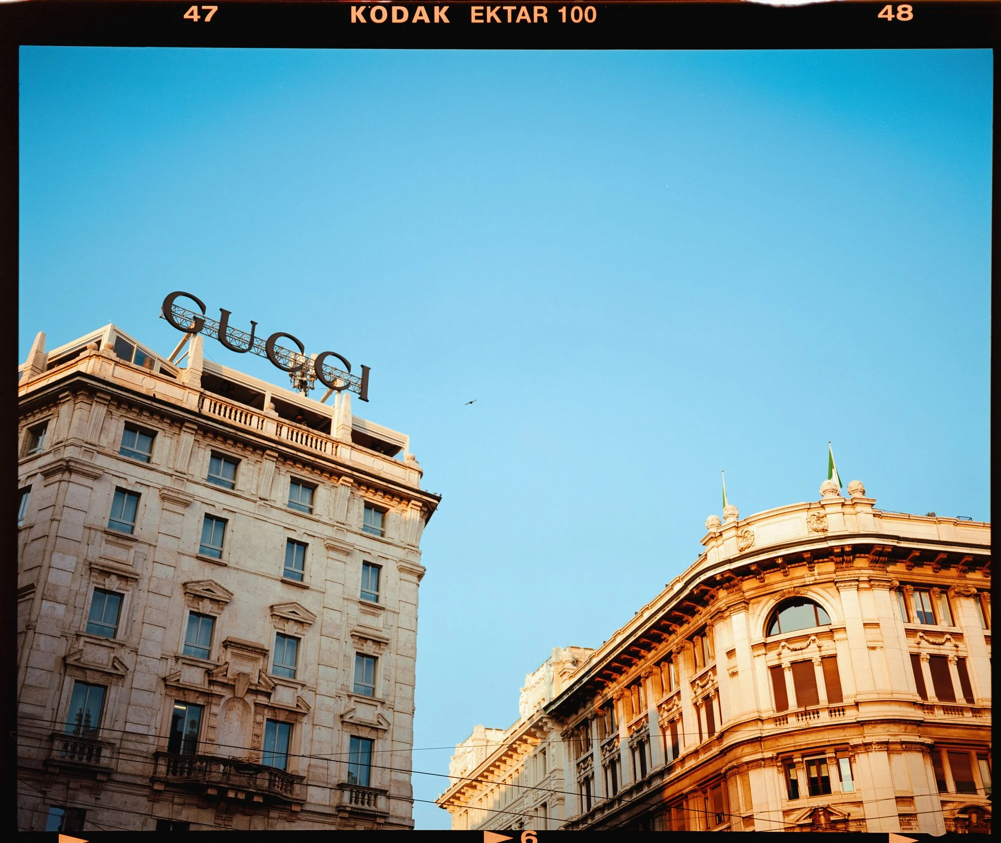 analog film photo of gucci sign in Milan the film stock is ektar 100