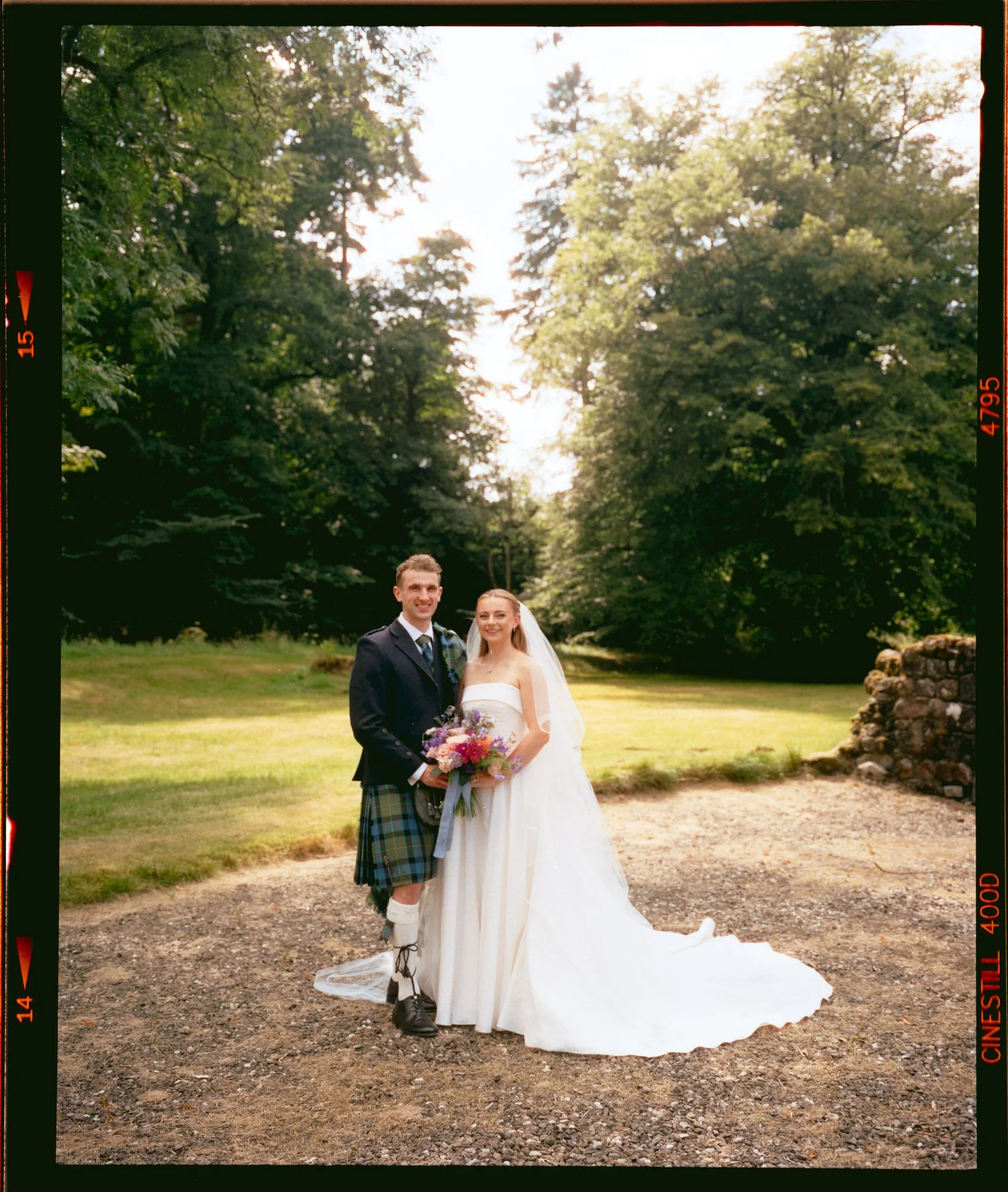 Bride and groom portrait in the sunlit Scottish countryside