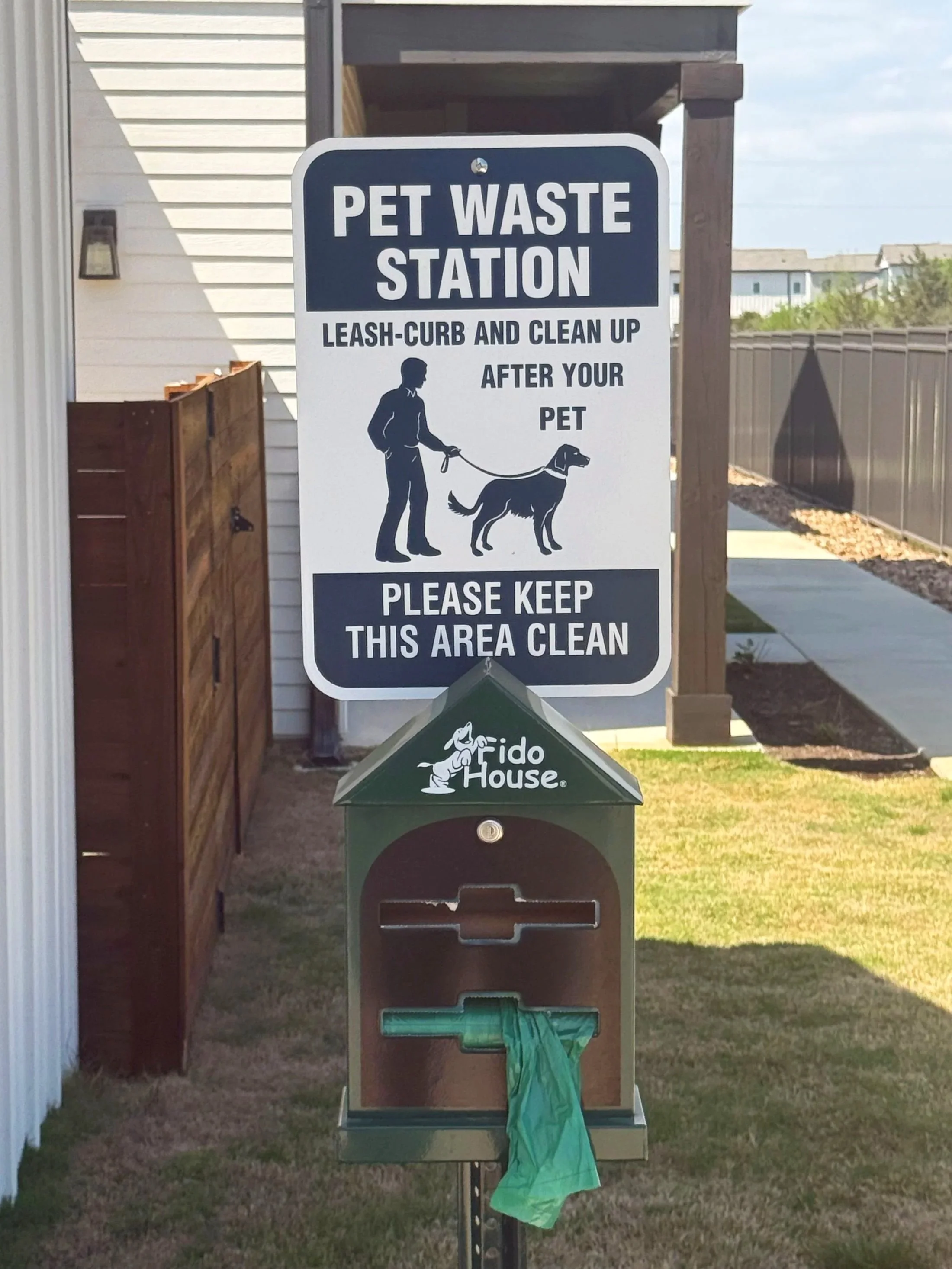 Pet waste station with bag dispenser at a San Antonio multi-unit community