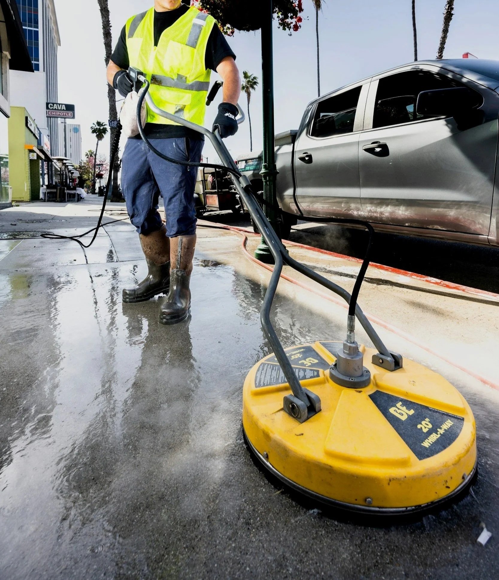 Pressure washing sidewalks at a San Antonio apartment community