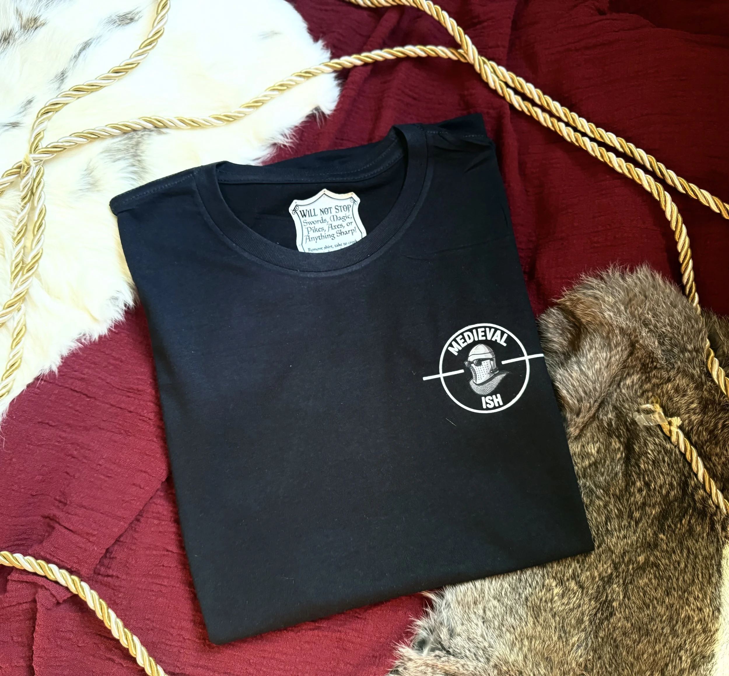 Black womens tee shirt with Medievalish logo on the front left