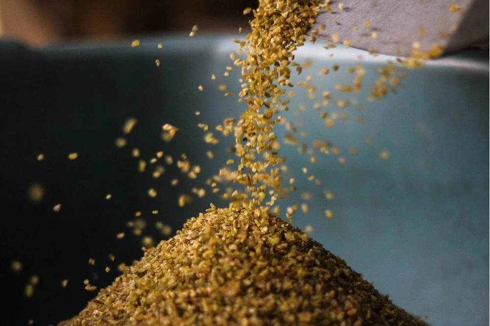 Coffee chaff flowing down into a pile