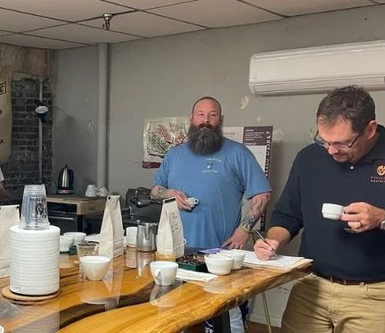 Matt Bolt evaluates coffee profile at weekly cupping for Vienna Coffee Company