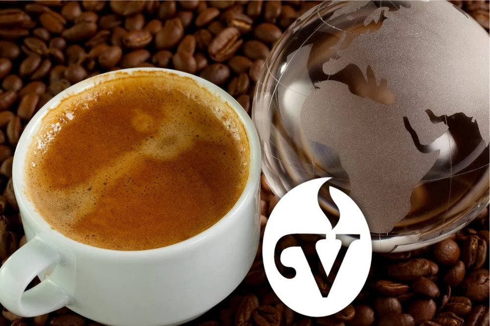 Cappuccino and glass globe on coffee beans