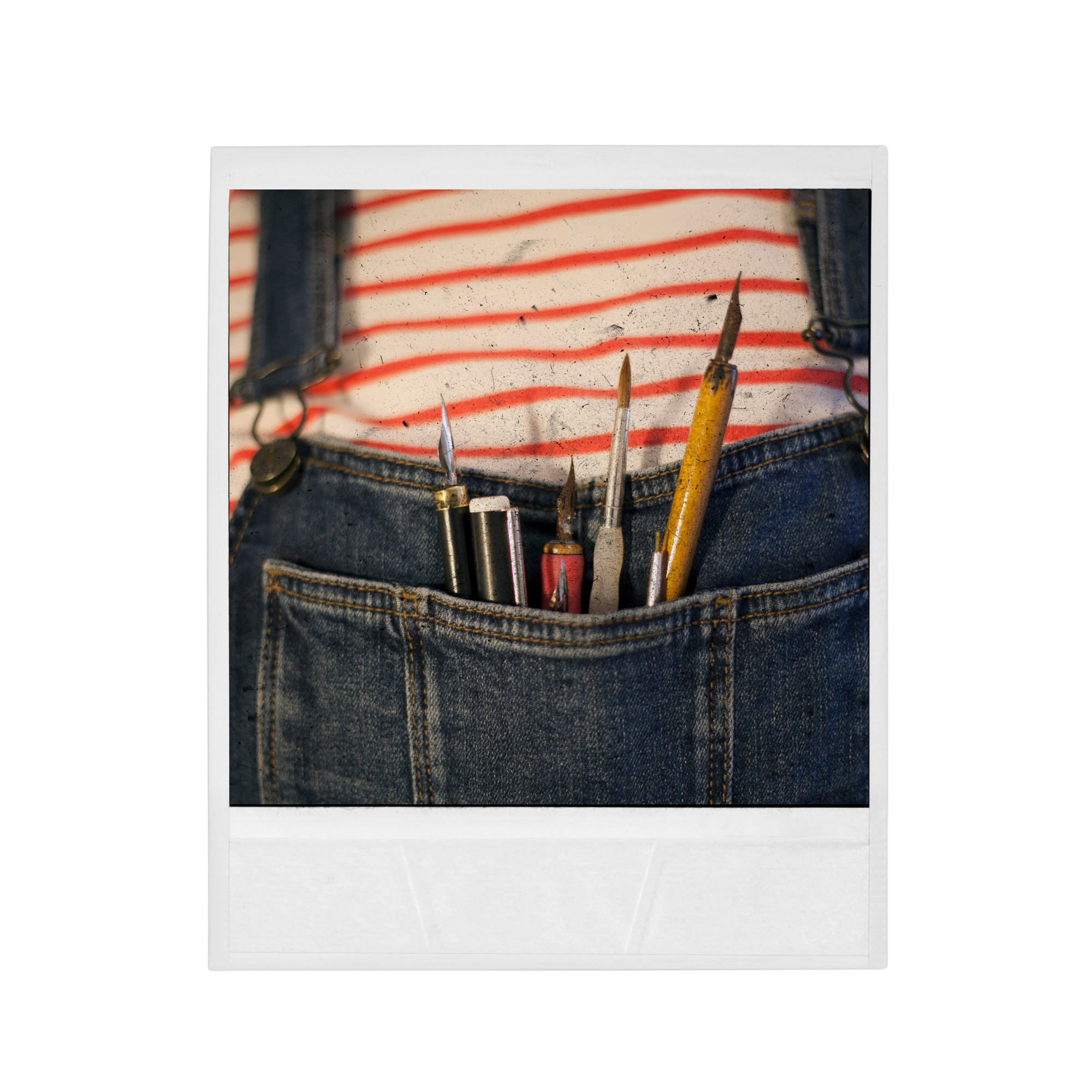 A white cardboard box with a clear plastic window showing several paintbrushes inside, placed on a black background.