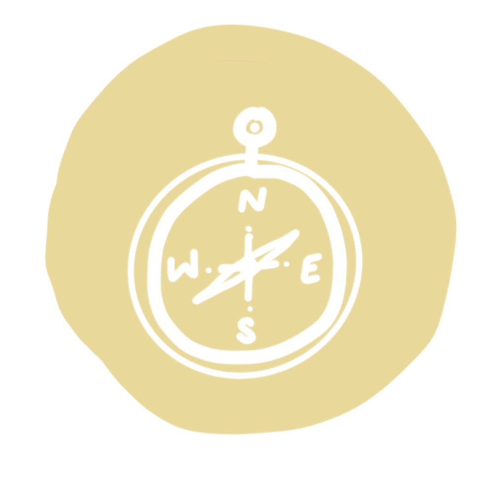 Illustration of a compass with cardinal directions, surrounded by a yellowish circle